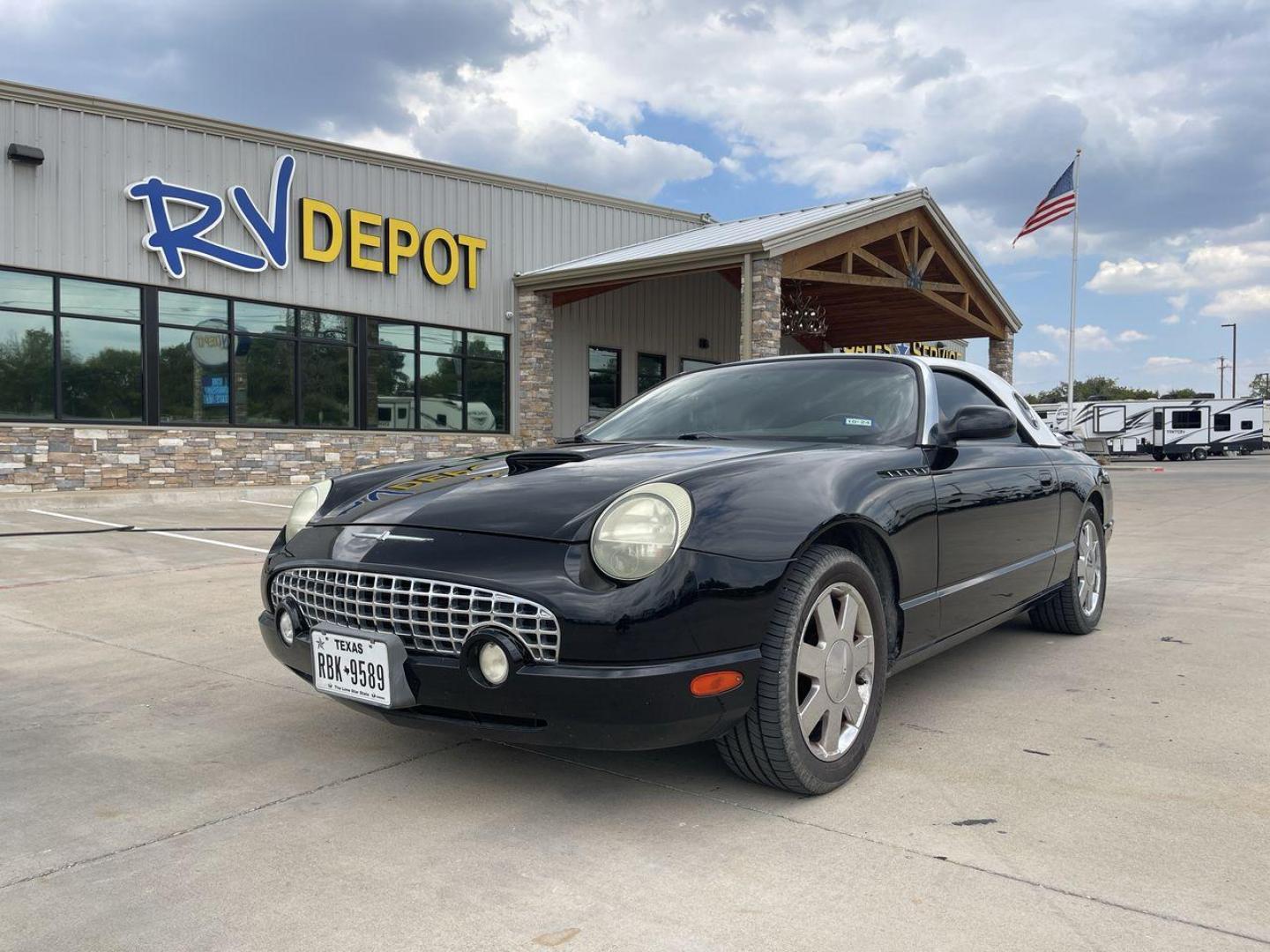 2002 BLACK FORD THUNDERBIRD (1FAHP60A82Y) , located at 4319 N Main St, Cleburne, TX, 76033, (817) 678-5133, 32.385960, -97.391212 - You will discover the appeal of the open road in this 2002 Ford Thunderbird 2-Door Convertible. It combines classic car design with modern performance. This iconic model, noted for its elegant lines and timeless grace, is in excellent condition and represents a collector's dream. The Thunderbird's - Photo#0