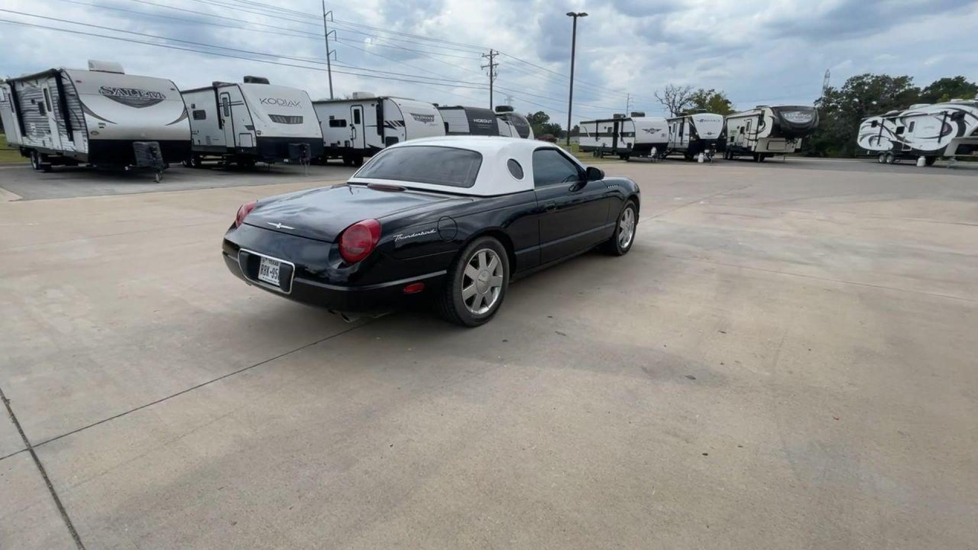 2002 BLACK FORD THUNDERBIRD (1FAHP60A82Y) , located at 4319 N Main St, Cleburne, TX, 76033, (817) 678-5133, 32.385960, -97.391212 - You will discover the appeal of the open road in this 2002 Ford Thunderbird 2-Door Convertible. It combines classic car design with modern performance. This iconic model, noted for its elegant lines and timeless grace, is in excellent condition and represents a collector's dream. The Thunderbird's - Photo#1