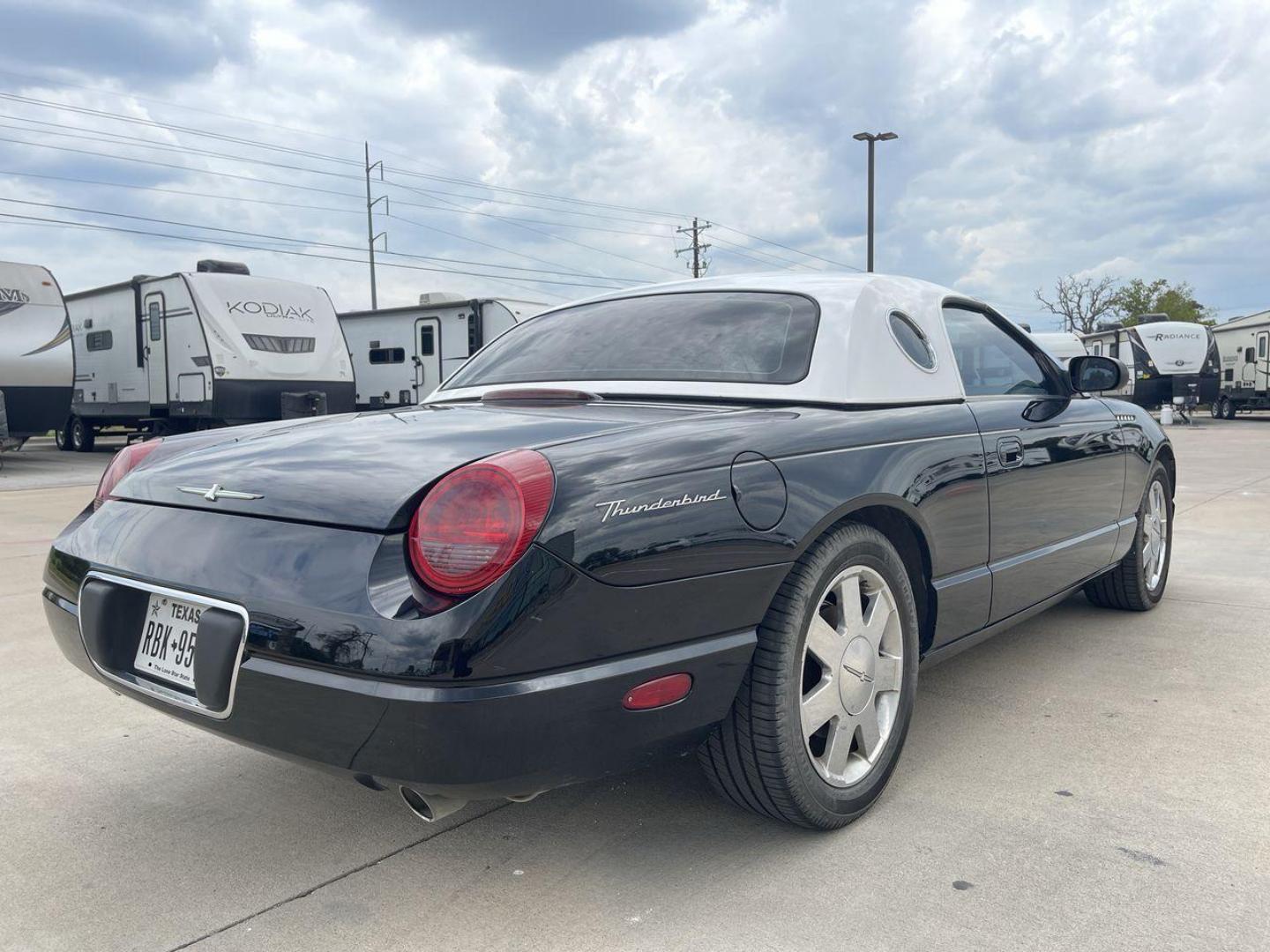 2002 BLACK FORD THUNDERBIRD (1FAHP60A82Y) , located at 4319 N Main St, Cleburne, TX, 76033, (817) 678-5133, 32.385960, -97.391212 - You will discover the appeal of the open road in this 2002 Ford Thunderbird 2-Door Convertible. It combines classic car design with modern performance. This iconic model, noted for its elegant lines and timeless grace, is in excellent condition and represents a collector's dream. The Thunderbird's - Photo#24