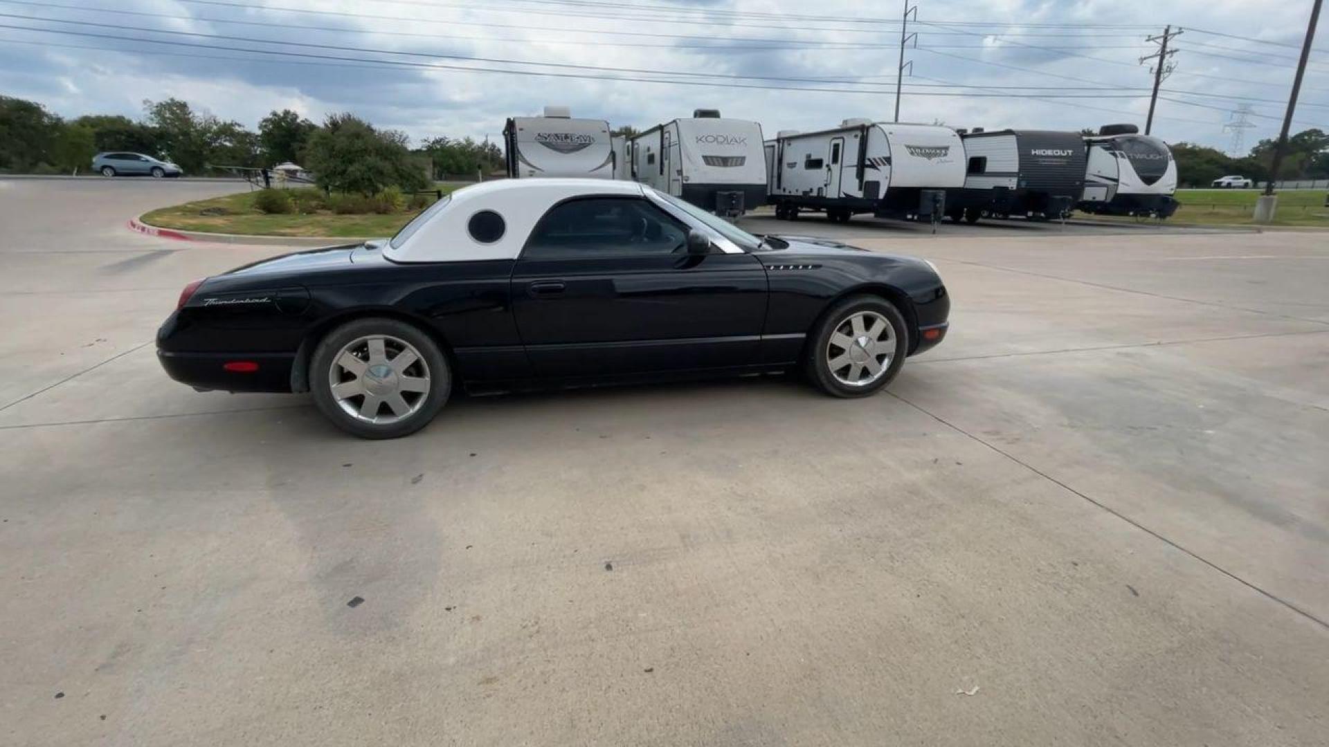 2002 BLACK FORD THUNDERBIRD (1FAHP60A82Y) , located at 4319 N Main St, Cleburne, TX, 76033, (817) 678-5133, 32.385960, -97.391212 - You will discover the appeal of the open road in this 2002 Ford Thunderbird 2-Door Convertible. It combines classic car design with modern performance. This iconic model, noted for its elegant lines and timeless grace, is in excellent condition and represents a collector's dream. The Thunderbird's - Photo#2