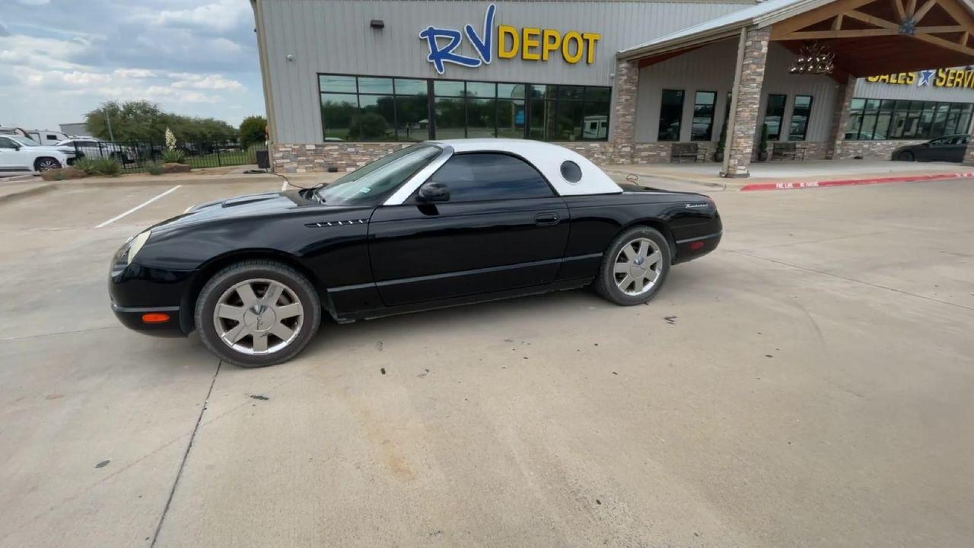 2002 BLACK FORD THUNDERBIRD (1FAHP60A82Y) , located at 4319 N Main St, Cleburne, TX, 76033, (817) 678-5133, 32.385960, -97.391212 - You will discover the appeal of the open road in this 2002 Ford Thunderbird 2-Door Convertible. It combines classic car design with modern performance. This iconic model, noted for its elegant lines and timeless grace, is in excellent condition and represents a collector's dream. The Thunderbird's - Photo#6