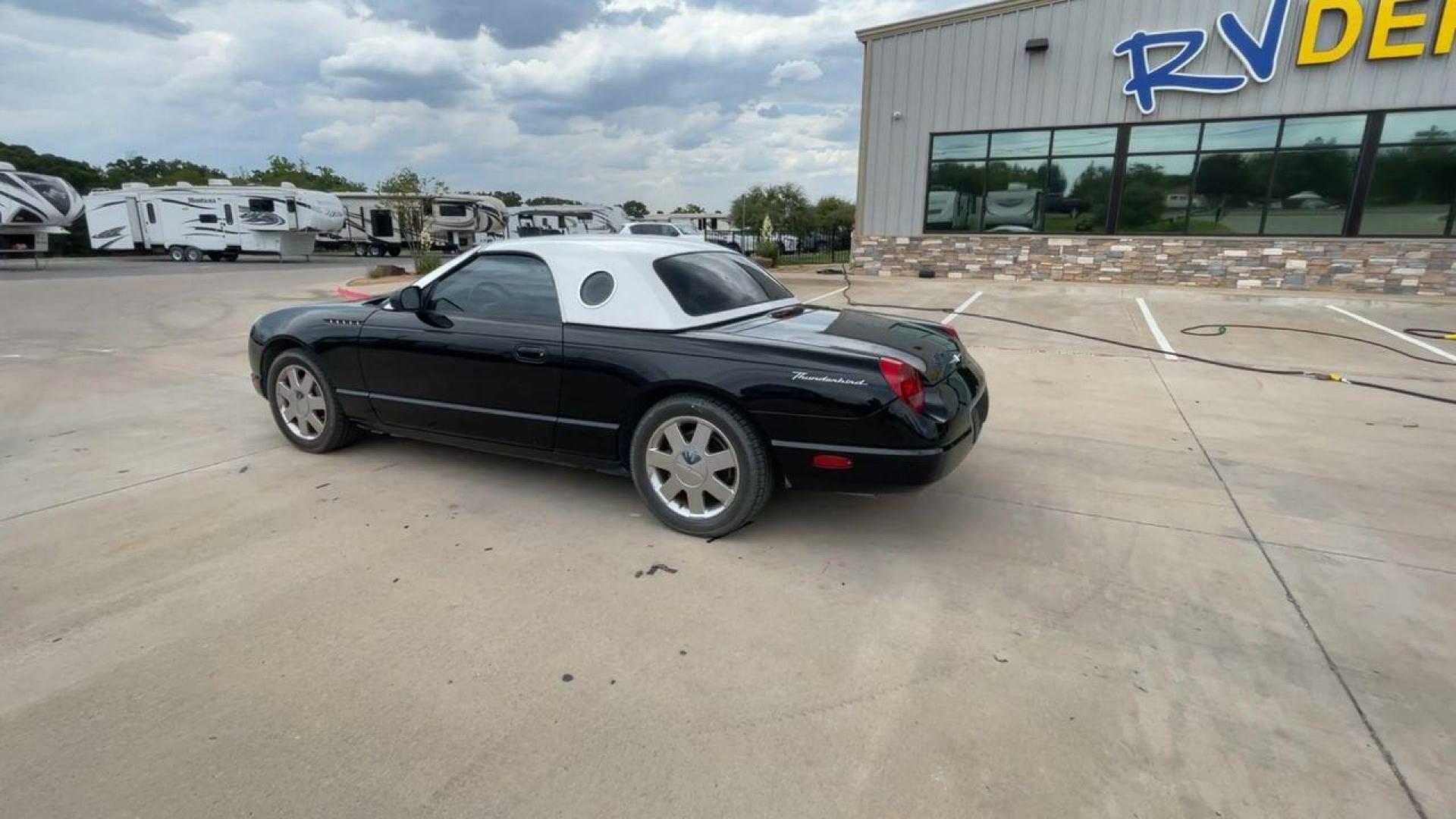 2002 BLACK FORD THUNDERBIRD (1FAHP60A82Y) , located at 4319 N Main St, Cleburne, TX, 76033, (817) 678-5133, 32.385960, -97.391212 - You will discover the appeal of the open road in this 2002 Ford Thunderbird 2-Door Convertible. It combines classic car design with modern performance. This iconic model, noted for its elegant lines and timeless grace, is in excellent condition and represents a collector's dream. The Thunderbird's - Photo#7