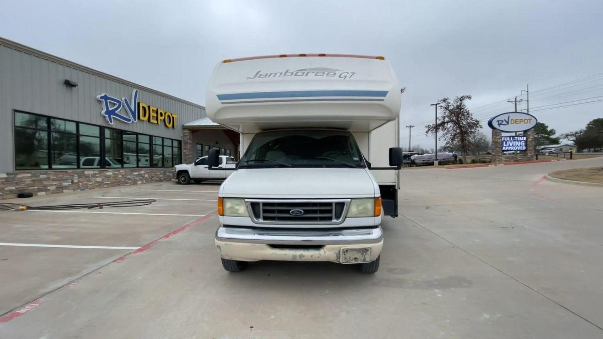 2003 WHITE FLEETWOOD JAMBOREE GT E450 (1FDXE45S93H) with an 6.8L V10 SOHC 20V engine, located at 4319 N Main St, Cleburne, TX, 76033, (817) 678-5133, 32.385960, -97.391212 - The 2003 Fleetwood Jamboree GT allows you to enjoy the beauty of nature. Experience the ultimate in RV luxury with rear roof access, providing unparalleled views from the comfort of your mobile abode. With a spacious awning and a slide-out feature, you'll have plenty of room to enjoy the outdoors an - Photo#4