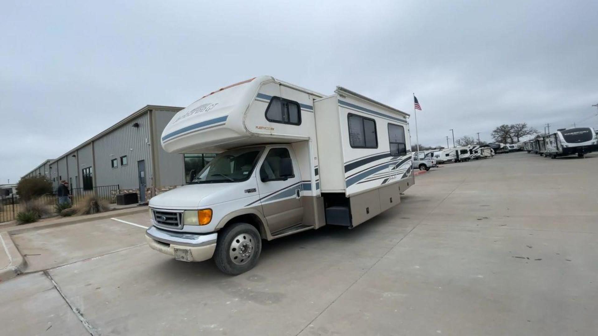 2003 WHITE FLEETWOOD JAMBOREE GT E450 (1FDXE45S93H) with an 6.8L V10 SOHC 20V engine, located at 4319 N Main St, Cleburne, TX, 76033, (817) 678-5133, 32.385960, -97.391212 - The 2003 Fleetwood Jamboree GT allows you to enjoy the beauty of nature. Experience the ultimate in RV luxury with rear roof access, providing unparalleled views from the comfort of your mobile abode. With a spacious awning and a slide-out feature, you'll have plenty of room to enjoy the outdoors an - Photo#5