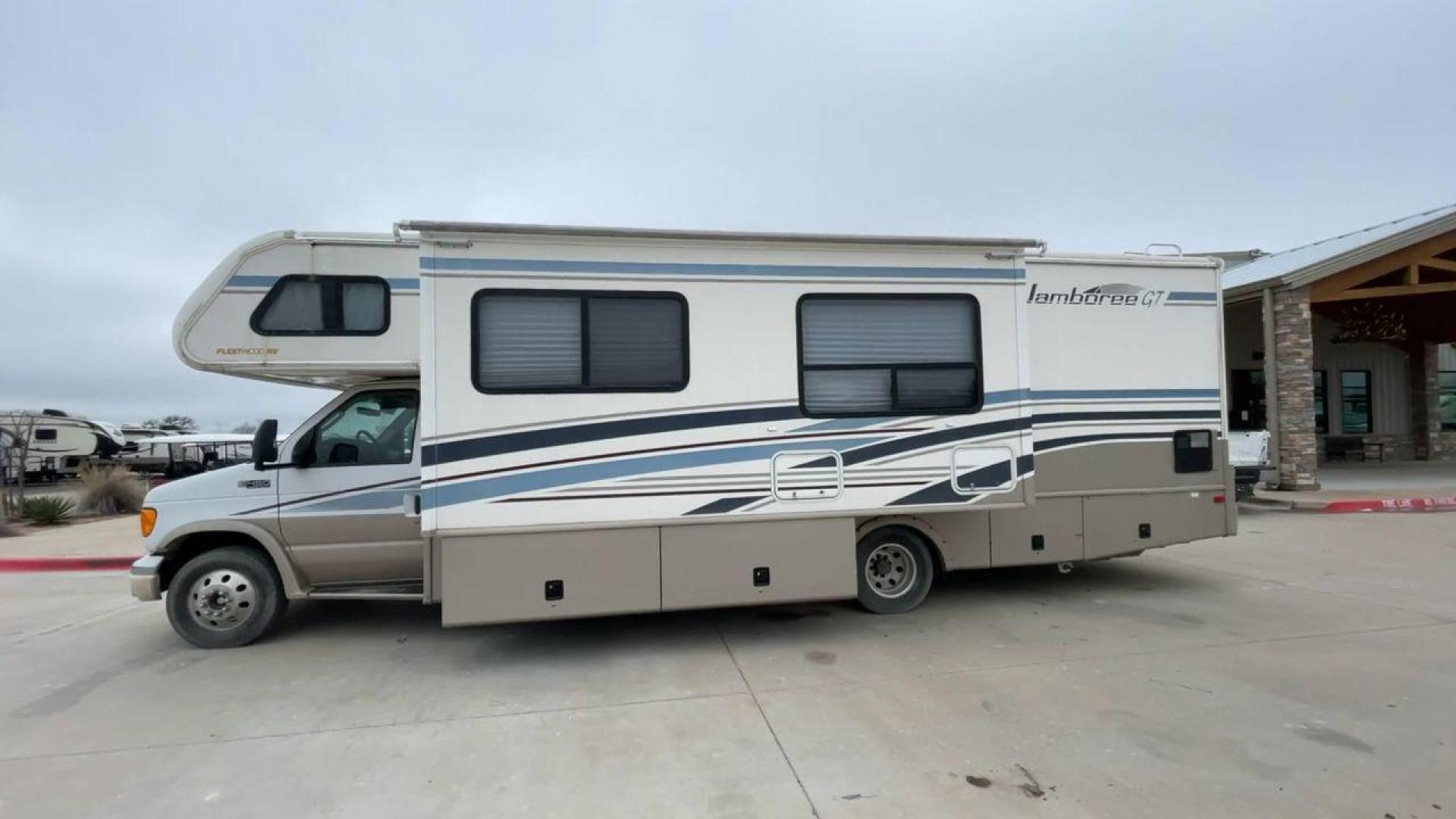 2003 WHITE FLEETWOOD JAMBOREE GT E450 (1FDXE45S93H) with an 6.8L V10 SOHC 20V engine, located at 4319 N Main St, Cleburne, TX, 76033, (817) 678-5133, 32.385960, -97.391212 - The 2003 Fleetwood Jamboree GT allows you to enjoy the beauty of nature. Experience the ultimate in RV luxury with rear roof access, providing unparalleled views from the comfort of your mobile abode. With a spacious awning and a slide-out feature, you'll have plenty of room to enjoy the outdoors an - Photo#6