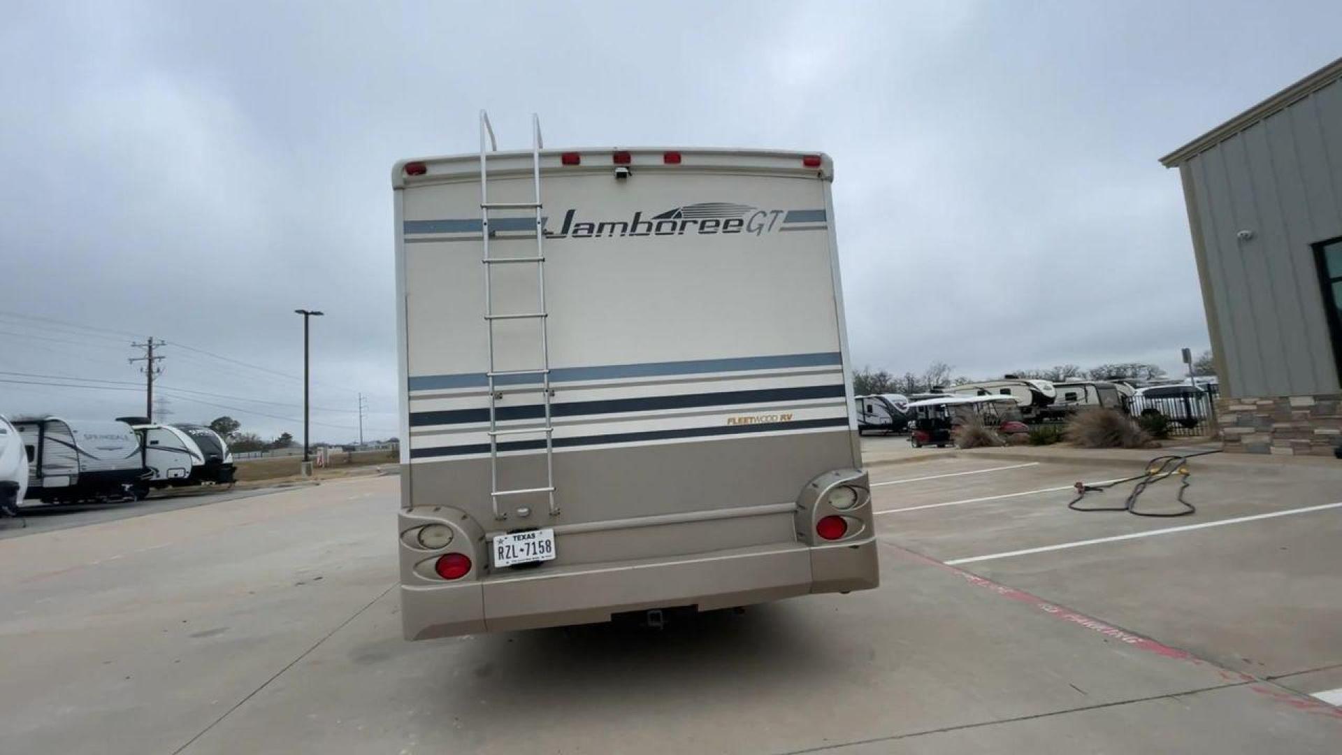 2003 WHITE FLEETWOOD JAMBOREE GT E450 (1FDXE45S93H) with an 6.8L V10 SOHC 20V engine, located at 4319 N Main St, Cleburne, TX, 76033, (817) 678-5133, 32.385960, -97.391212 - The 2003 Fleetwood Jamboree GT allows you to enjoy the beauty of nature. Experience the ultimate in RV luxury with rear roof access, providing unparalleled views from the comfort of your mobile abode. With a spacious awning and a slide-out feature, you'll have plenty of room to enjoy the outdoors an - Photo#8