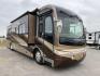 2006 FLEETWOOD REVOLUTION 40J (4VZBR1J9X6C) , Length: 40 ft | GVWR: 34,000 lbs | Slides: 3 transmission, located at 4319 N Main St, Cleburne, TX, 76033, (817) 678-5133, 32.385960, -97.391212 - The 2006 Fleetwood Revolution 40E is a stylish and well-maintained travel trailer. It has 77,049 miles on it! The front has a sleek and rounded windshield that offers excellent visibility for the driver. Its two-tone color scheme of brown, beige, and gold gives it a luxurious look. The chrome side m - Photo#0