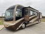 2006 FLEETWOOD REVOLUTION 40J (4VZBR1J9X6C) , Length: 40 ft | GVWR: 34,000 lbs | Slides: 3 transmission, located at 4319 N Main St, Cleburne, TX, 76033, (817) 678-5133, 32.385960, -97.391212 - The 2006 Fleetwood Revolution 40E is a stylish and well-maintained travel trailer. It has 77,049 miles on it! The front has a sleek and rounded windshield that offers excellent visibility for the driver. Its two-tone color scheme of brown, beige, and gold gives it a luxurious look. The chrome side m - Photo#14