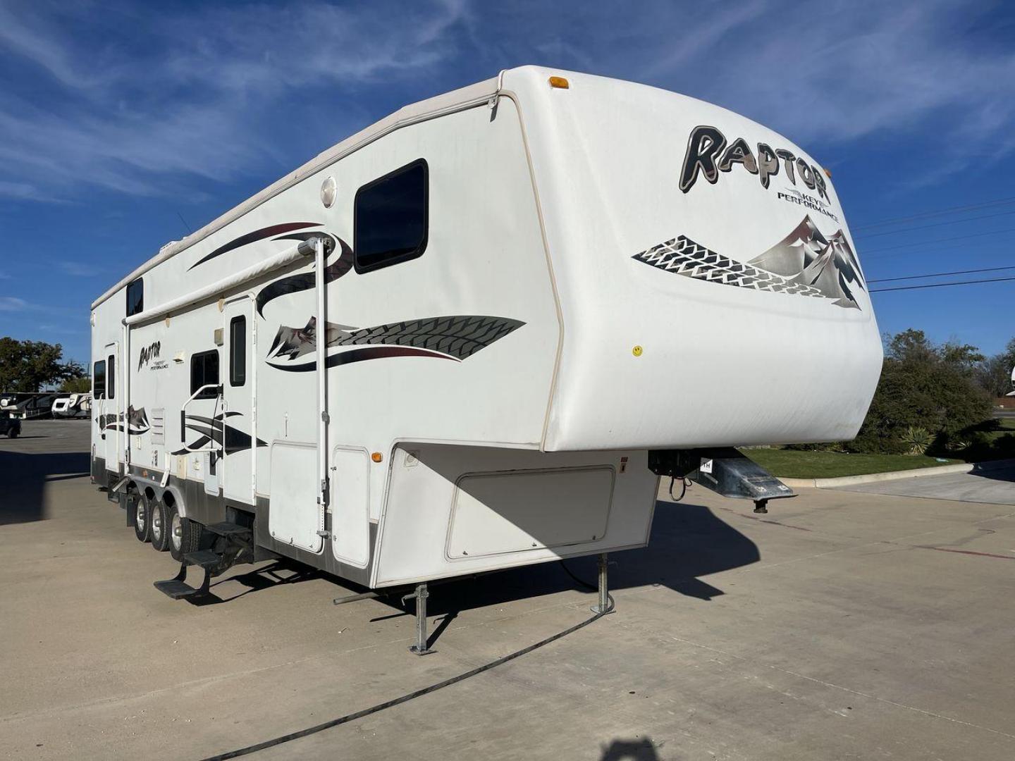 2006 KEYSTONE RAPTOR (4YDF361376M) , Length: 37.58 ft | Dry Weight: 11,615 lbs | Slides: 2 transmission, located at 4319 N Main St, Cleburne, TX, 76033, (817) 678-5133, 32.385960, -97.391212 - The 2016 Keystone Raptor RP3612 is a fifth-wheel toy hauler with a bold and functional exterior. It features a white body with stylish decals that include swooping lines and mountain graphics, giving it a sporty and adventurous look. The RV has three axles, offering stability and support for its lar - Photo#22