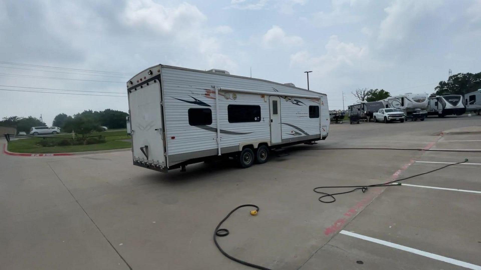 2008 WHITE ADRENALINE 23FS (1TC2B180683) , Length: 28.67 ft | Dry Weight: 6,474 lbs | Gross Weight: 9,500 lbs | Slides: 9 transmission, located at 4319 N Main St, Cleburne, TX, 76033, (817) 678-5133, 32.385960, -97.391212 - The 2008 Adrenaline 23FS Toy Hauler is prepared for a journey! It is 28.67 feet long and weighs 6,474 pounds when dry. It's lightweight and portable, but large enough to hold all of your favorite toys and accessories. It can accommodate up to 9,500 pounds, so you'll have plenty of room for your next - Photo#1