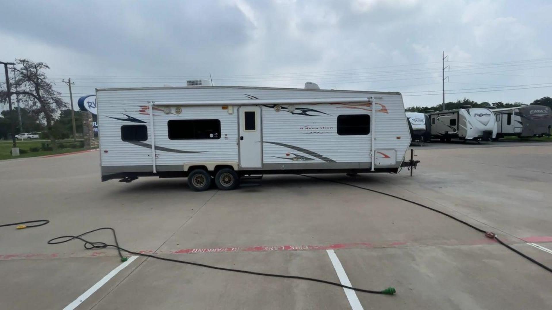 2008 WHITE ADRENALINE 23FS (1TC2B180683) , Length: 28.67 ft | Dry Weight: 6,474 lbs | Gross Weight: 9,500 lbs | Slides: 9 transmission, located at 4319 N Main St, Cleburne, TX, 76033, (817) 678-5133, 32.385960, -97.391212 - The 2008 Adrenaline 23FS Toy Hauler is prepared for a journey! It is 28.67 feet long and weighs 6,474 pounds when dry. It's lightweight and portable, but large enough to hold all of your favorite toys and accessories. It can accommodate up to 9,500 pounds, so you'll have plenty of room for your next - Photo#2