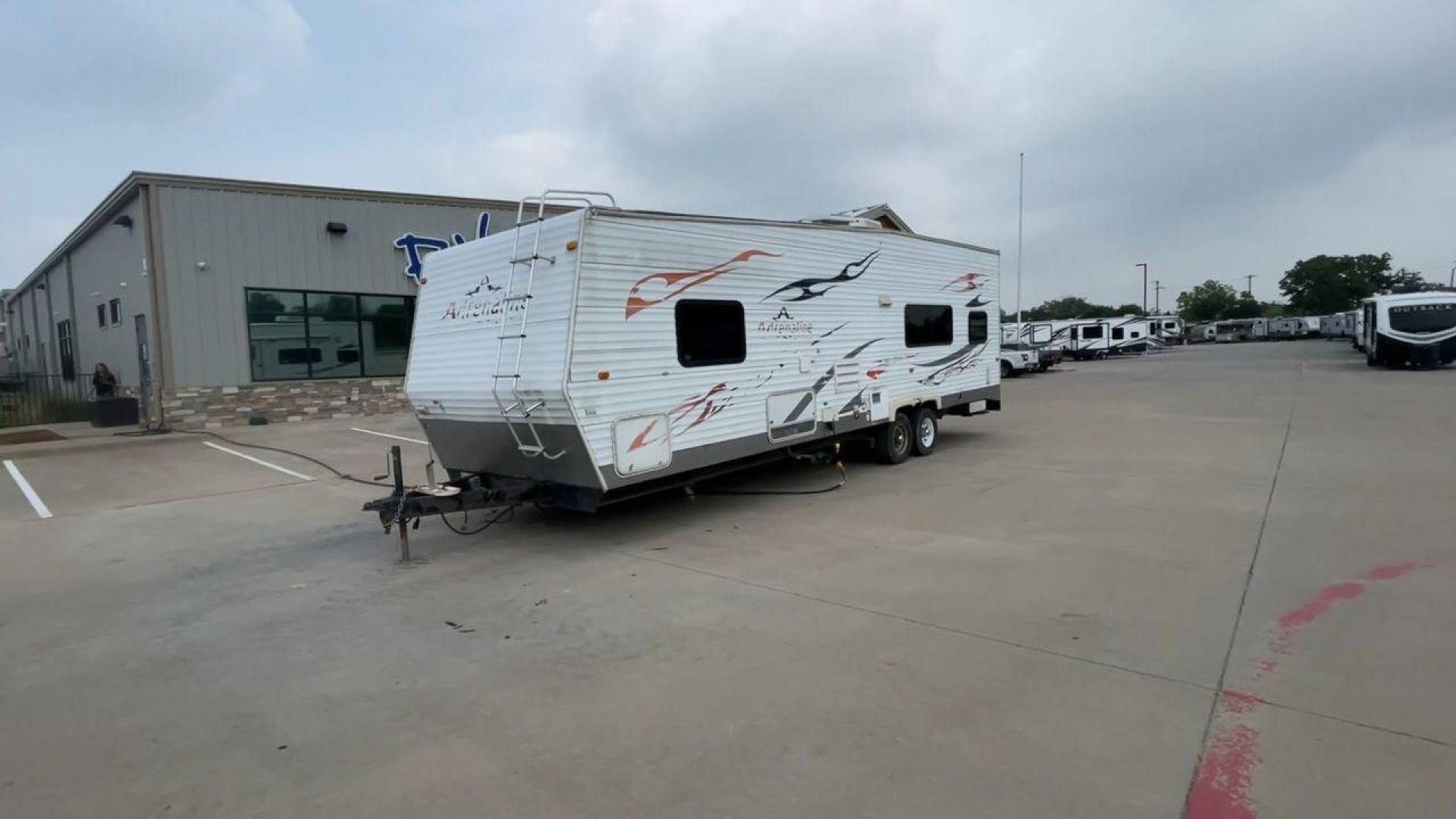 2008 WHITE ADRENALINE 23FS (1TC2B180683) , Length: 28.67 ft | Dry Weight: 6,474 lbs | Gross Weight: 9,500 lbs | Slides: 9 transmission, located at 4319 N Main St, Cleburne, TX, 76033, (817) 678-5133, 32.385960, -97.391212 - The 2008 Adrenaline 23FS Toy Hauler is prepared for a journey! It is 28.67 feet long and weighs 6,474 pounds when dry. It's lightweight and portable, but large enough to hold all of your favorite toys and accessories. It can accommodate up to 9,500 pounds, so you'll have plenty of room for your next - Photo#5