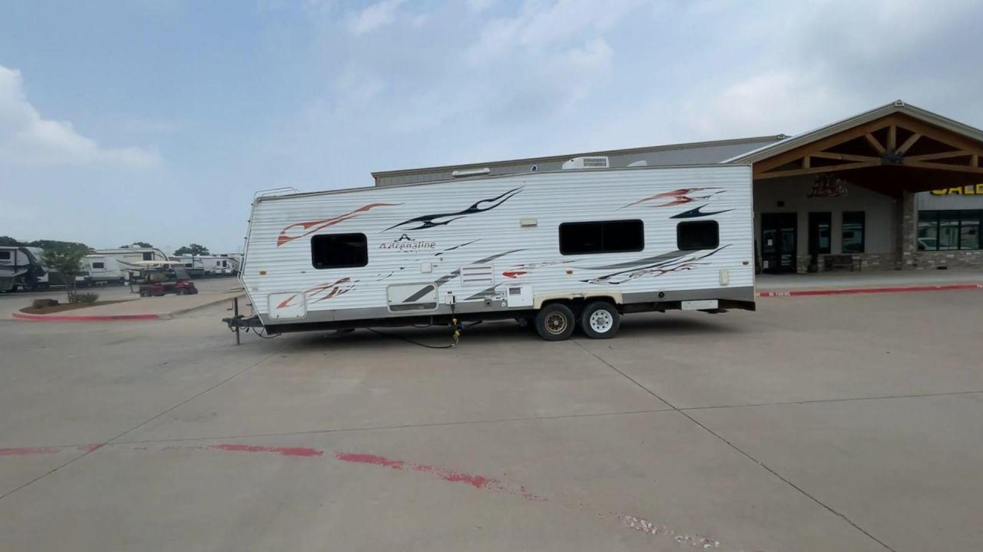 2008 WHITE ADRENALINE 23FS (1TC2B180683) , Length: 28.67 ft | Dry Weight: 6,474 lbs | Gross Weight: 9,500 lbs | Slides: 9 transmission, located at 4319 N Main St, Cleburne, TX, 76033, (817) 678-5133, 32.385960, -97.391212 - The 2008 Adrenaline 23FS Toy Hauler is prepared for a journey! It is 28.67 feet long and weighs 6,474 pounds when dry. It's lightweight and portable, but large enough to hold all of your favorite toys and accessories. It can accommodate up to 9,500 pounds, so you'll have plenty of room for your next - Photo#6