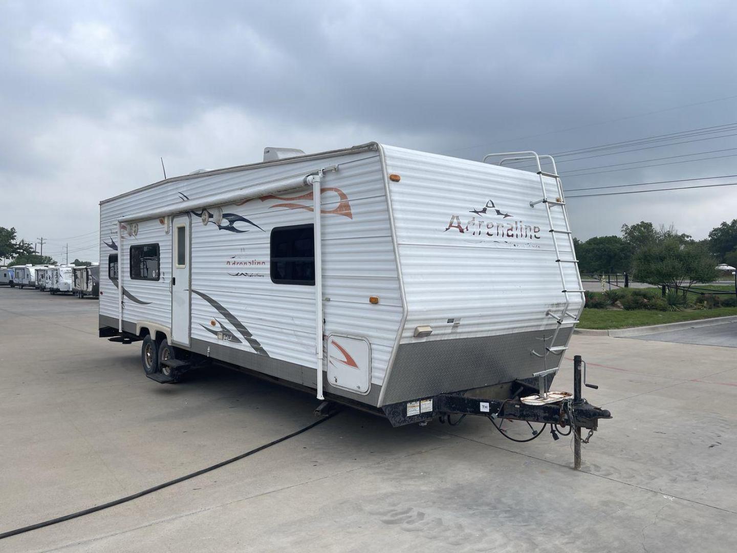 2008 WHITE ADRENALINE 23FS (1TC2B180683) , Length: 28.67 ft | Dry Weight: 6,474 lbs | Gross Weight: 9,500 lbs | Slides: 9 transmission, located at 4319 N Main St, Cleburne, TX, 76033, (817) 678-5133, 32.385960, -97.391212 - The 2008 Adrenaline 23FS Toy Hauler is prepared for a journey! It is 28.67 feet long and weighs 6,474 pounds when dry. It's lightweight and portable, but large enough to hold all of your favorite toys and accessories. It can accommodate up to 9,500 pounds, so you'll have plenty of room for your next - Photo#23