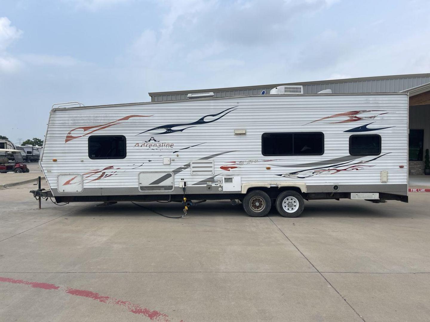 2008 WHITE ADRENALINE 23FS (1TC2B180683) , Length: 28.67 ft | Dry Weight: 6,474 lbs | Gross Weight: 9,500 lbs | Slides: 9 transmission, located at 4319 N Main St, Cleburne, TX, 76033, (817) 678-5133, 32.385960, -97.391212 - The 2008 Adrenaline 23FS Toy Hauler is prepared for a journey! It is 28.67 feet long and weighs 6,474 pounds when dry. It's lightweight and portable, but large enough to hold all of your favorite toys and accessories. It can accommodate up to 9,500 pounds, so you'll have plenty of room for your next - Photo#24