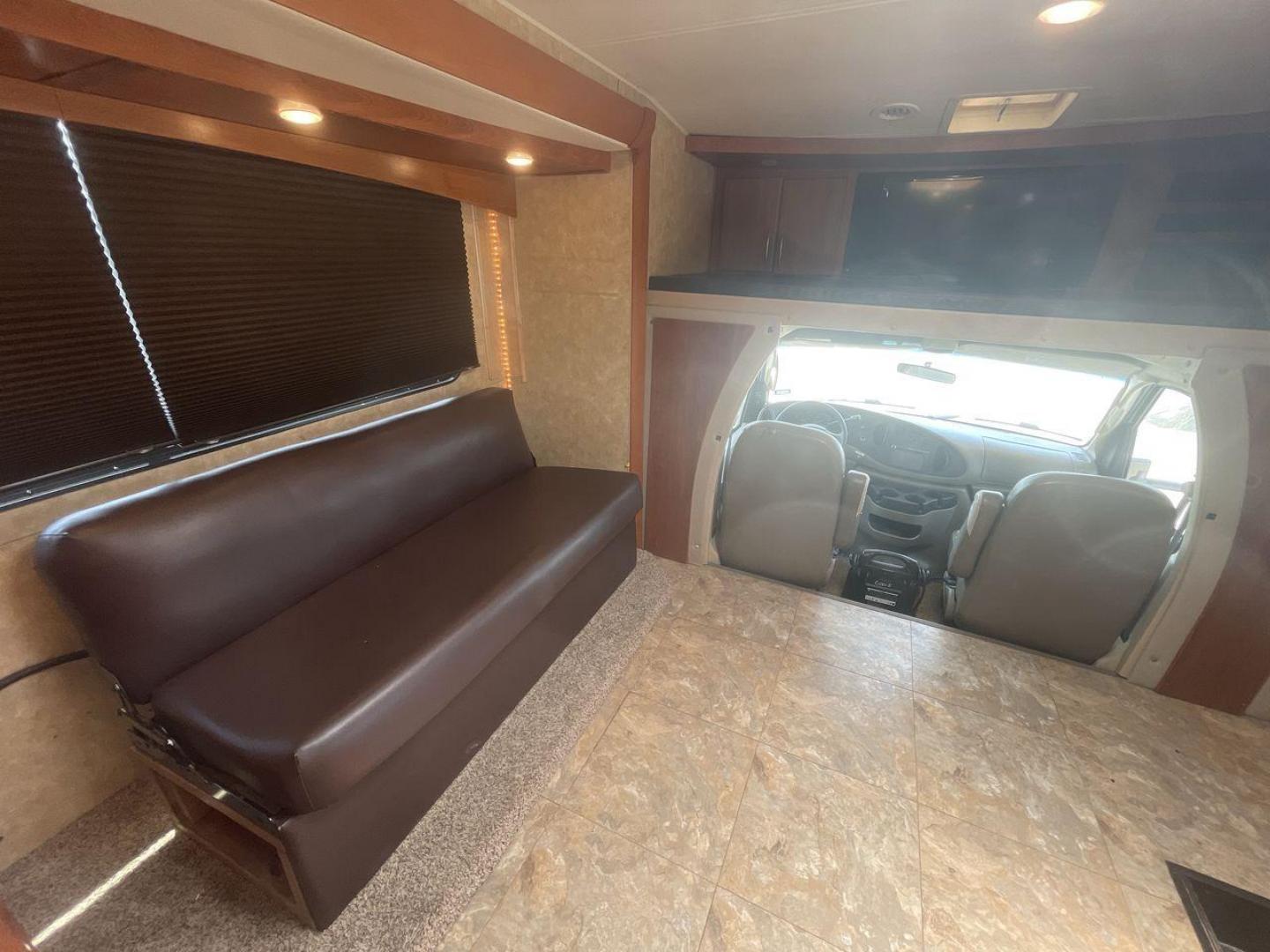 2008 TAN COACHMEN LEPRECHAUN 320DS E-450 (1FDXE45S08D) with an 6.8L V10 SOHC 20V engine, Length: 31.5 ft. | Dry Weight: 12,555 lbs. | Gross Weight: 14,500 lbs. | Slides: 2 transmission, located at 4319 N Main St, Cleburne, TX, 76033, (817) 678-5133, 32.385960, -97.391212 - The 2008 Coachmen Leprechaun 320DS is a Class C motorhome with a compact design of 31.5-foot length. It is designed to ease your travels without compromising on space or amenities. With a substantial dry weight of 12,555 lbs and a gross weight capacity of 14,500 lbs, it is built to handle all your t - Photo#11