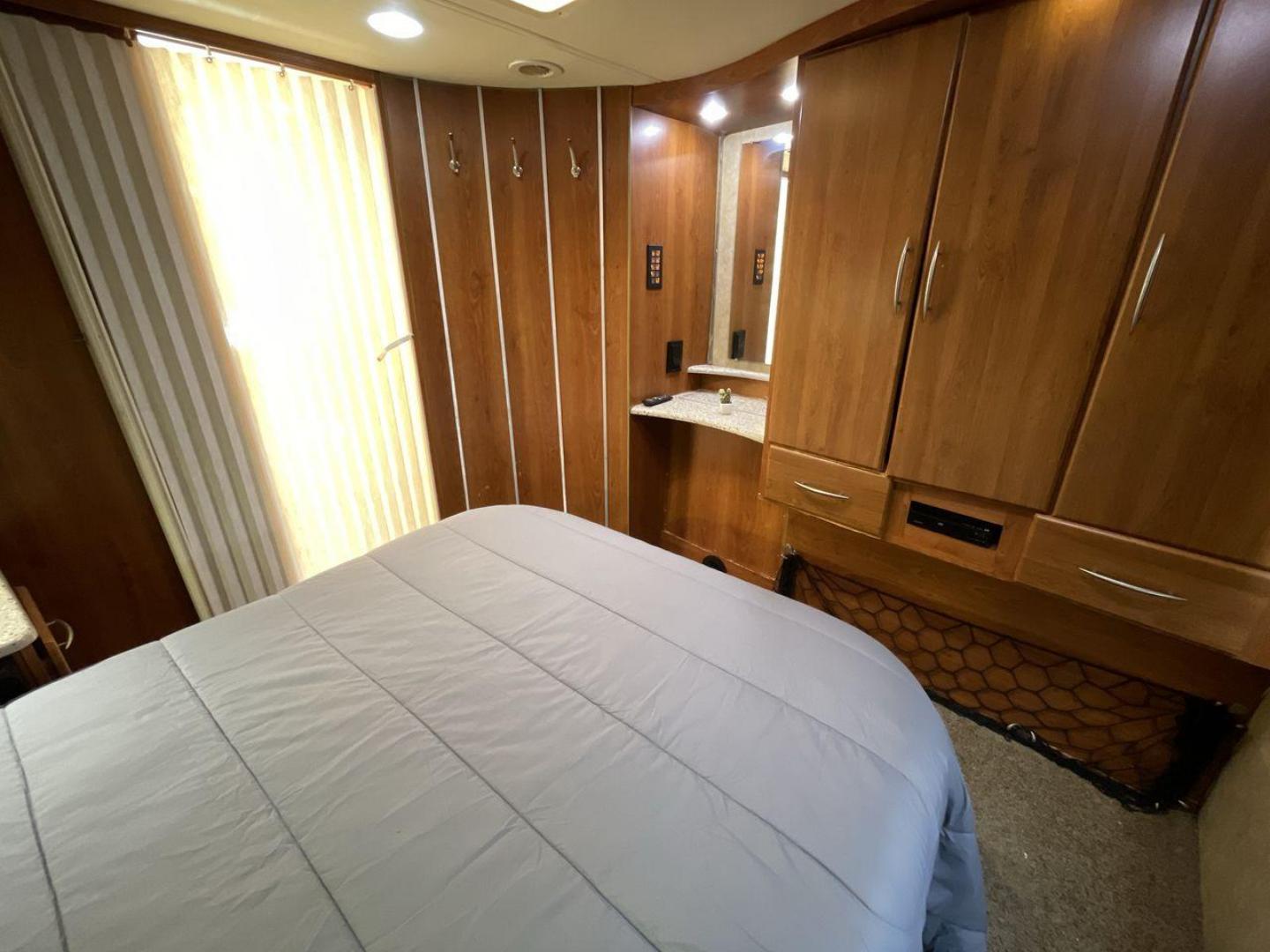 2008 TAN COACHMEN LEPRECHAUN 320DS E-450 (1FDXE45S08D) with an 6.8L V10 SOHC 20V engine, Length: 31.5 ft. | Dry Weight: 12,555 lbs. | Gross Weight: 14,500 lbs. | Slides: 2 transmission, located at 4319 N Main St, Cleburne, TX, 76033, (817) 678-5133, 32.385960, -97.391212 - The 2008 Coachmen Leprechaun 320DS is a Class C motorhome with a compact design of 31.5-foot length. It is designed to ease your travels without compromising on space or amenities. With a substantial dry weight of 12,555 lbs and a gross weight capacity of 14,500 lbs, it is built to handle all your t - Photo#18