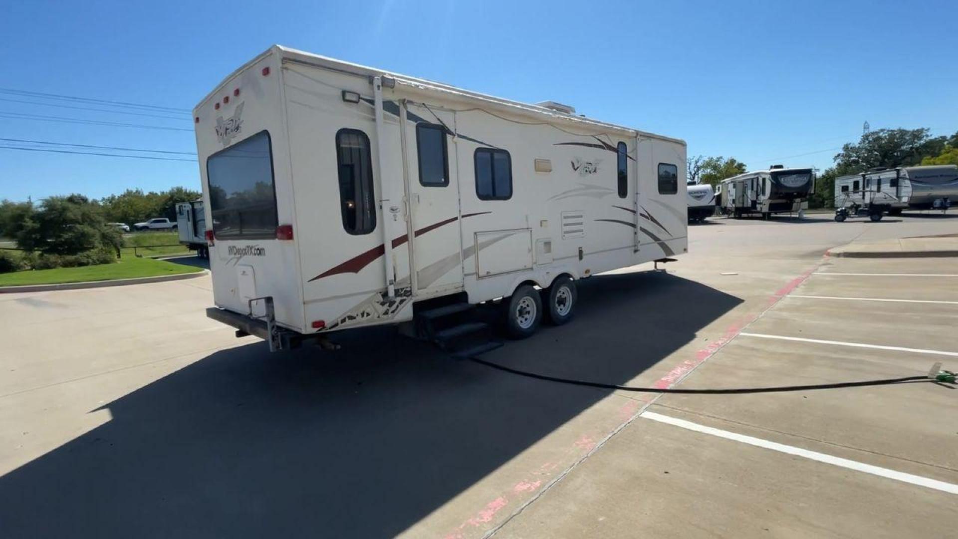 2008 WHITE VR-1 299RLS (4YDT299268V) , Length: 33 ft. | Dry Weight: 6,810 lbs. | Slides: 1 transmission, located at 4319 N Main St, Cleburne, TX, 76033, (817) 678-5133, 32.385960, -97.391212 - The 2008 VR-1 299RLS is a dual-axle steel wheel setup measuring 33 ft. long and 11.17 ft. tall. It has a dry weight of 6,810 lbs. and a payload capacity of 2,805 lbs. It also has a hitch weight of 815 lbs. It includes one slide and one power awning. This travel trailer features a rear living floorpl - Photo#1