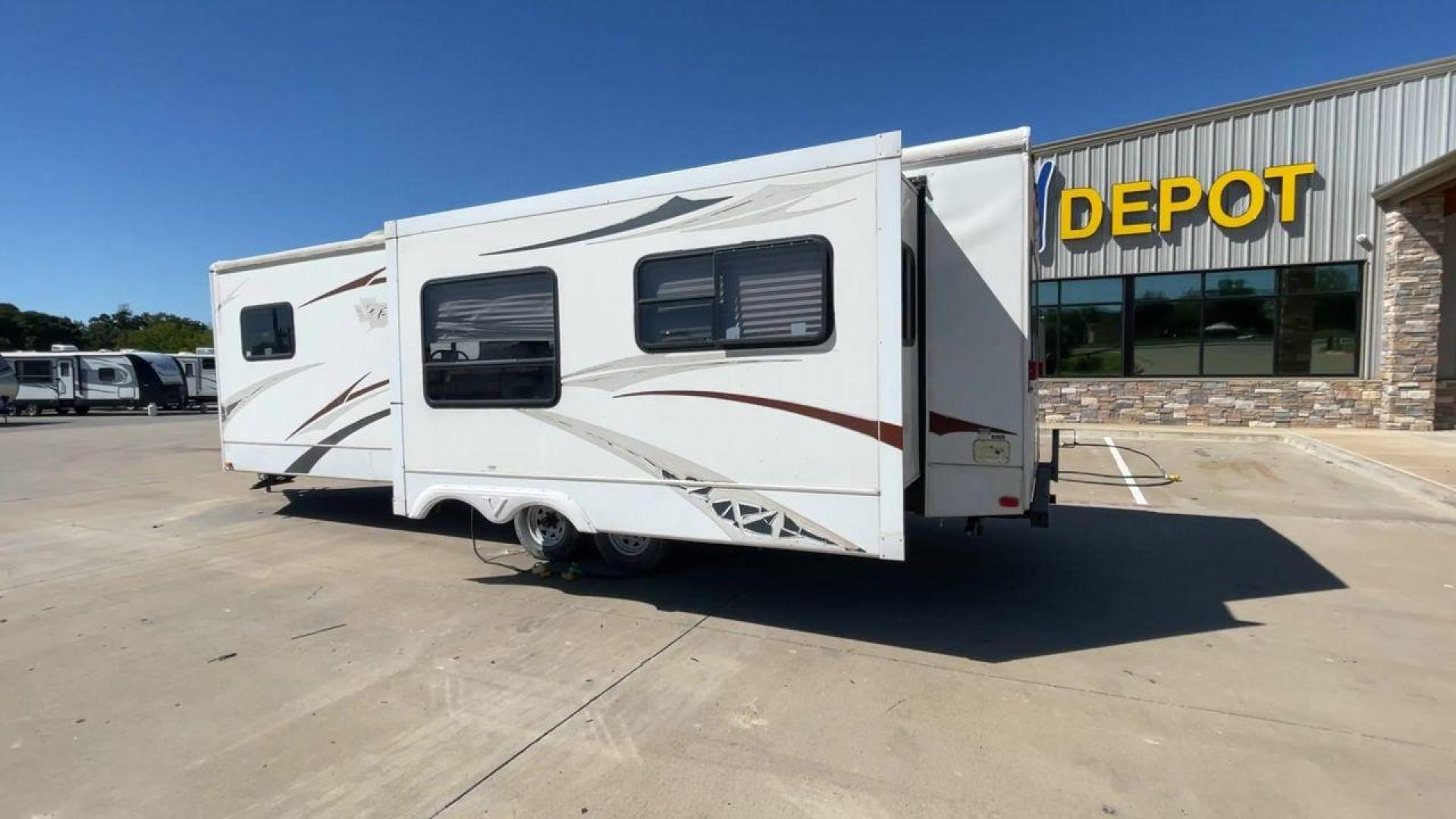 2008 WHITE VR-1 299RLS (4YDT299268V) , Length: 33 ft. | Dry Weight: 6,810 lbs. | Slides: 1 transmission, located at 4319 N Main St, Cleburne, TX, 76033, (817) 678-5133, 32.385960, -97.391212 - The 2008 VR-1 299RLS is a dual-axle steel wheel setup measuring 33 ft. long and 11.17 ft. tall. It has a dry weight of 6,810 lbs. and a payload capacity of 2,805 lbs. It also has a hitch weight of 815 lbs. It includes one slide and one power awning. This travel trailer features a rear living floorpl - Photo#7