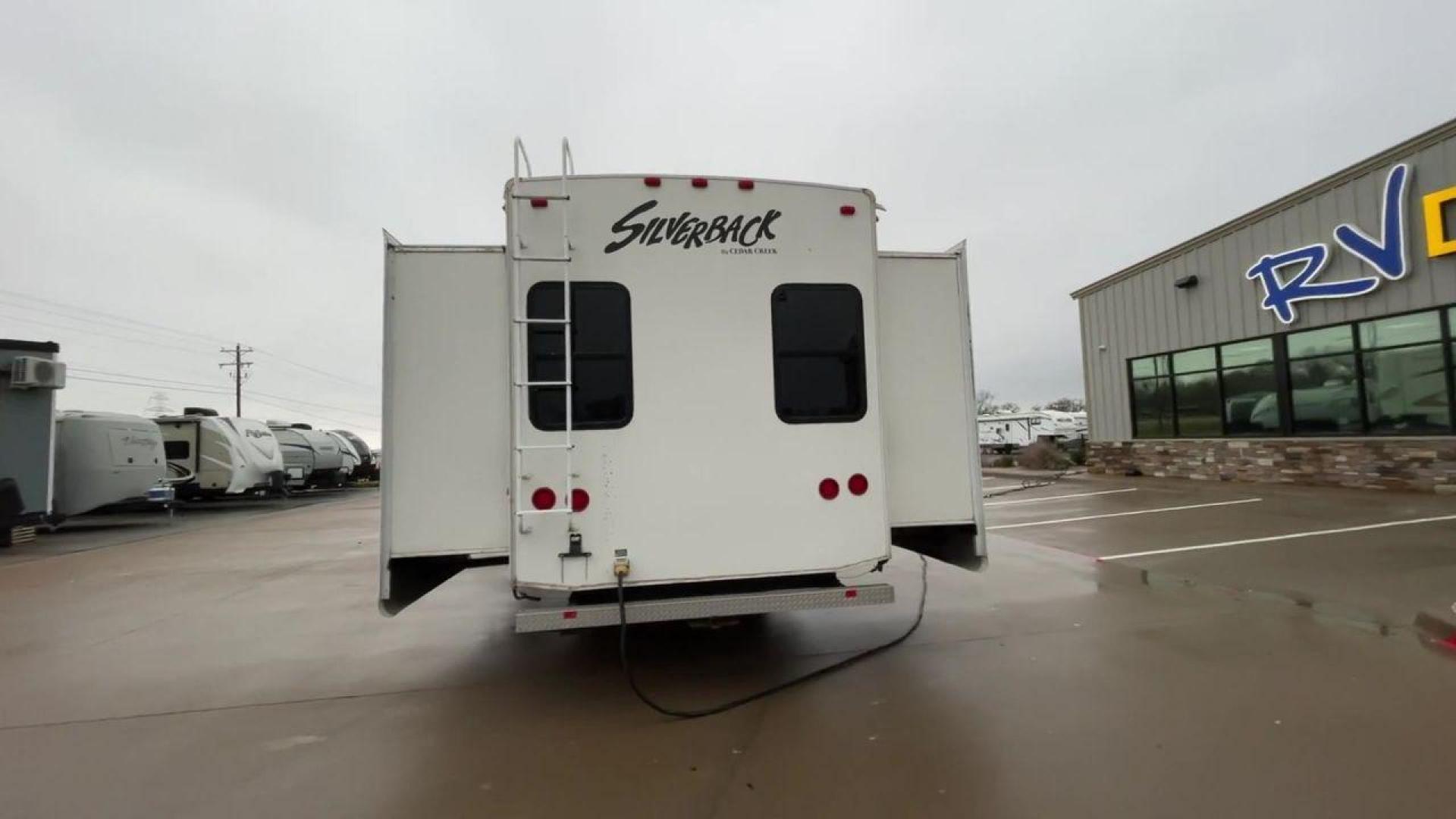 2010 WHITE CEDAR CREEK SILVERBA 35QB (4X4FCRL22AS) , Length: 41 ft.| Dry Weight: 12,184 lbs | Gross Weight: 15,500 lbs | Slides: 4 transmission, located at 4319 N Main St, Cleburne, TX, 76033, (817) 678-5133, 32.385960, -97.391212 - With a length of 39 feet, the 35QB floor plan offers a private bunkhouse at the rear, ensuring a cozy retreat for the little ones or a group of friends. Its spacious living area with slide-outs expands the interior space for comfortable dining and entertainment. The kitchen is equipped with resident - Photo#8