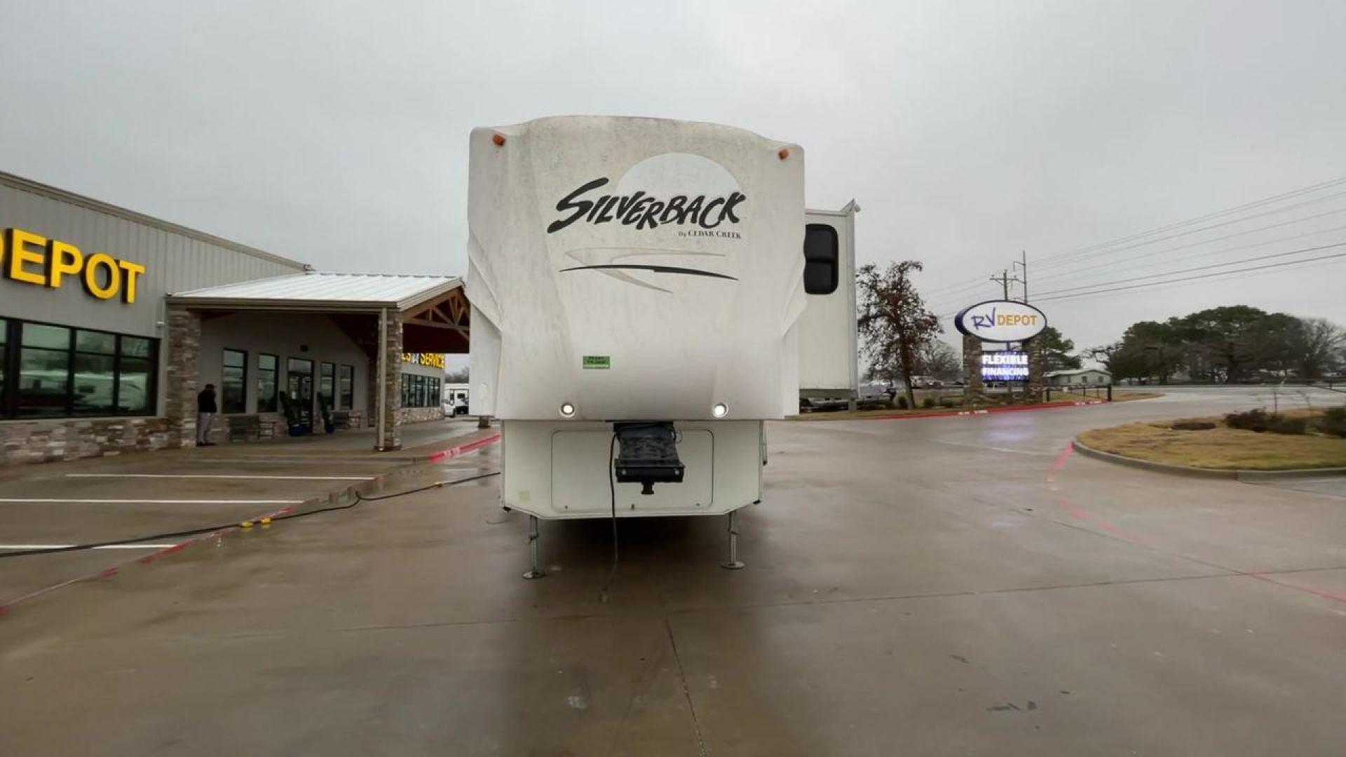 2010 WHITE CEDAR CREEK SILVERBA 35QB (4X4FCRL22AS) , Length: 41 ft.| Dry Weight: 12,184 lbs | Gross Weight: 15,500 lbs | Slides: 4 transmission, located at 4319 N Main St, Cleburne, TX, 76033, (817) 678-5133, 32.385960, -97.391212 - With a length of 39 feet, the 35QB floor plan offers a private bunkhouse at the rear, ensuring a cozy retreat for the little ones or a group of friends. Its spacious living area with slide-outs expands the interior space for comfortable dining and entertainment. The kitchen is equipped with resident - Photo#4