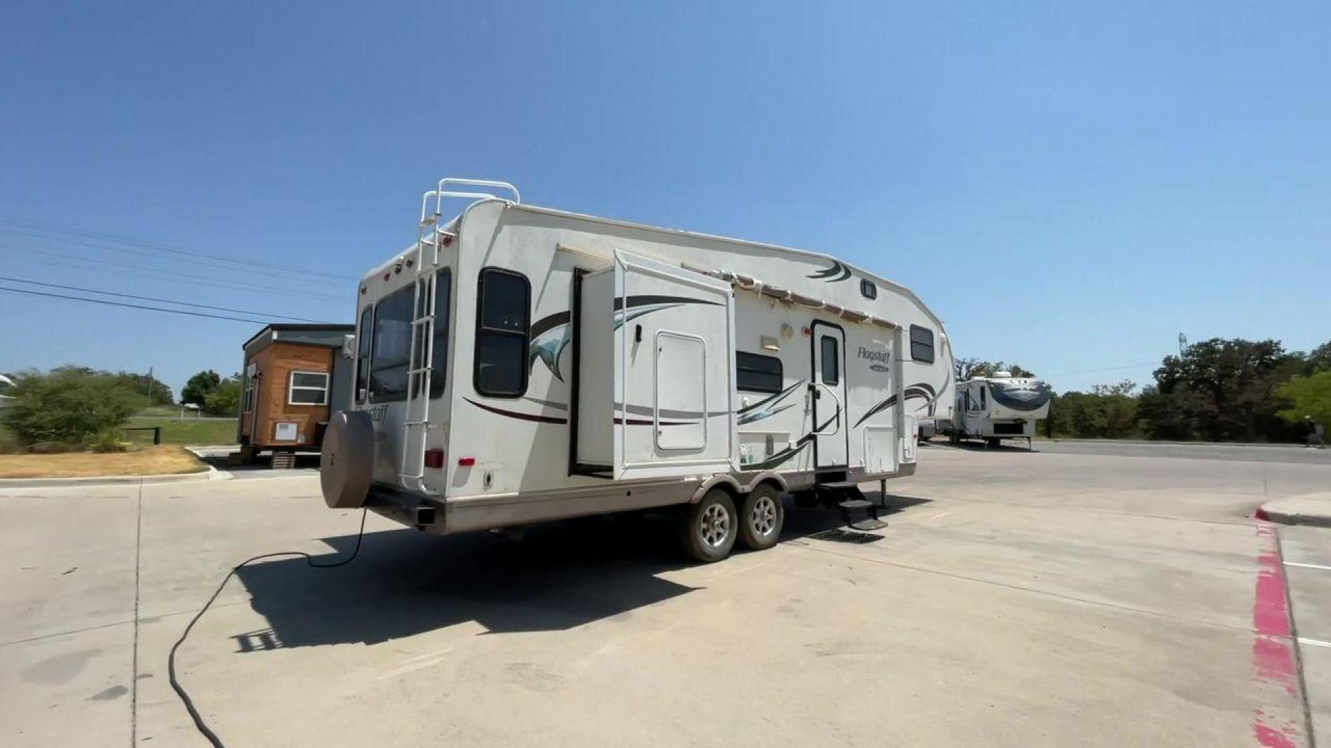 2010 WHITE FLAGSTAFF 8528CKSS - (4X4FFLD20A1) , Length: 30 ft. | Dry Weight: 6,877 lbs. | Slides: 2 transmission, located at 4319 N Main St, Cleburne, TX, 76033, (817) 678-5133, 32.385960, -97.391212 - The 2010 Flagstaff 8528CKSS CT is a well-crafted and compact travel trailer designed for comfort and convenience on the road. With a length of 30 feet 11 inches, a width of 8 feet, and a height of 12 feet 7 inches, this trailer offers a balance of space and maneuverability. Its thoughtful constructi - Photo#1