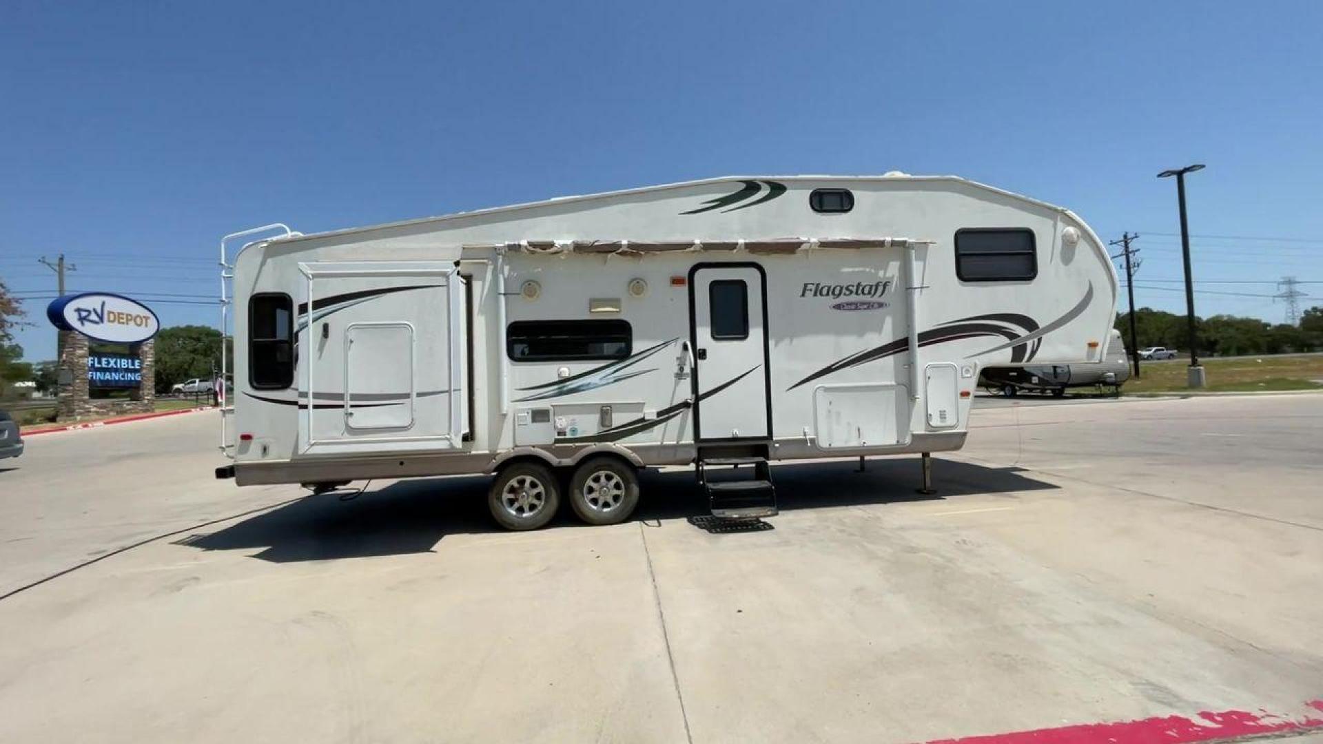 2010 WHITE FLAGSTAFF 8528CKSS - (4X4FFLD20A1) , Length: 30 ft. | Dry Weight: 6,877 lbs. | Slides: 2 transmission, located at 4319 N Main St, Cleburne, TX, 76033, (817) 678-5133, 32.385960, -97.391212 - The 2010 Flagstaff 8528CKSS CT is a well-crafted and compact travel trailer designed for comfort and convenience on the road. With a length of 30 feet 11 inches, a width of 8 feet, and a height of 12 feet 7 inches, this trailer offers a balance of space and maneuverability. Its thoughtful constructi - Photo#2