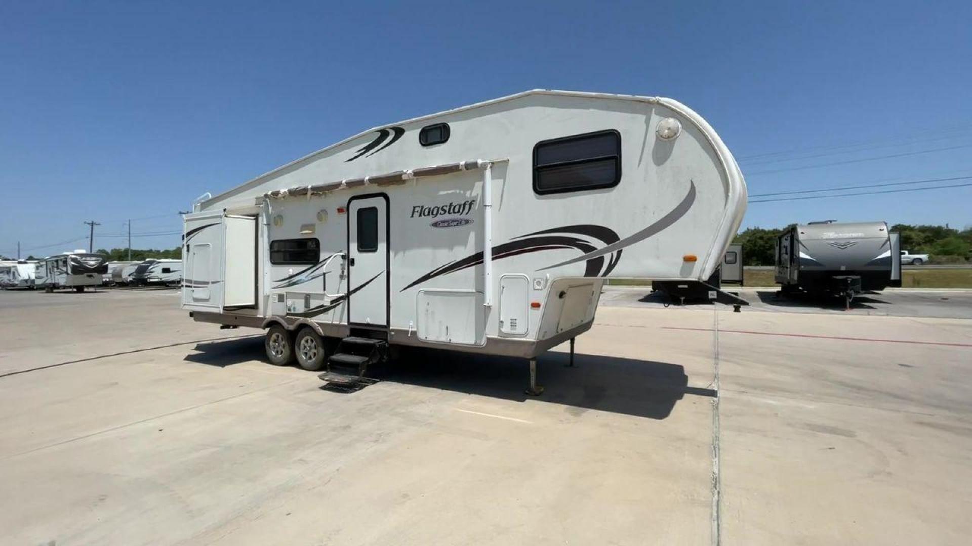 2010 WHITE FLAGSTAFF 8528CKSS - (4X4FFLD20A1) , Length: 30 ft. | Dry Weight: 6,877 lbs. | Slides: 2 transmission, located at 4319 N Main St, Cleburne, TX, 76033, (817) 678-5133, 32.385960, -97.391212 - The 2010 Flagstaff 8528CKSS CT is a well-crafted and compact travel trailer designed for comfort and convenience on the road. With a length of 30 feet 11 inches, a width of 8 feet, and a height of 12 feet 7 inches, this trailer offers a balance of space and maneuverability. Its thoughtful constructi - Photo#3