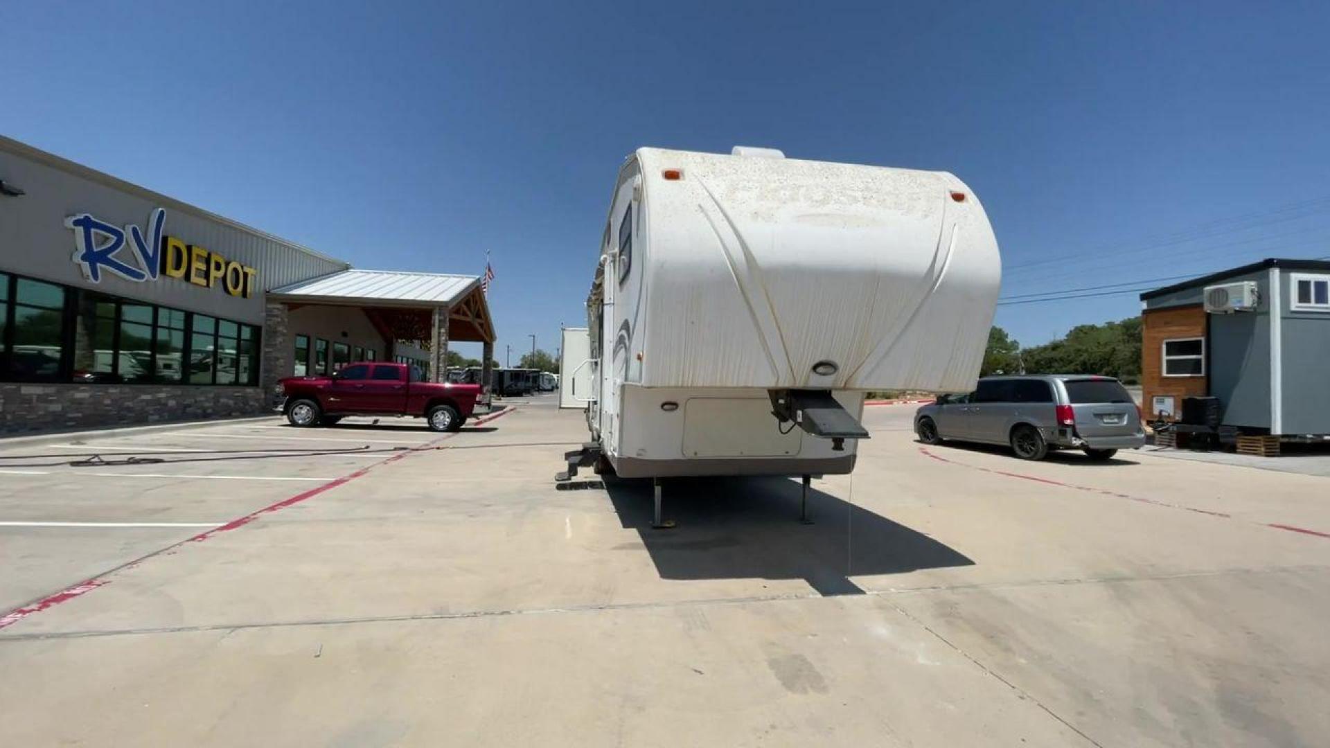 2010 WHITE FLAGSTAFF 8528CKSS - (4X4FFLD20A1) , Length: 30 ft. | Dry Weight: 6,877 lbs. | Slides: 2 transmission, located at 4319 N Main St, Cleburne, TX, 76033, (817) 678-5133, 32.385960, -97.391212 - The 2010 Flagstaff 8528CKSS CT is a well-crafted and compact travel trailer designed for comfort and convenience on the road. With a length of 30 feet 11 inches, a width of 8 feet, and a height of 12 feet 7 inches, this trailer offers a balance of space and maneuverability. Its thoughtful constructi - Photo#4