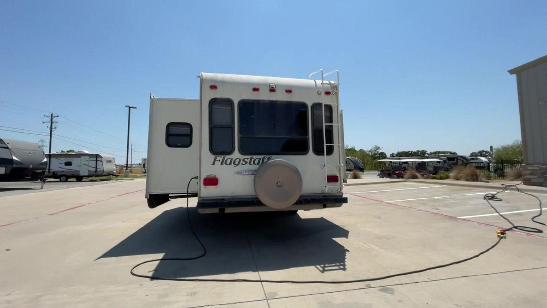 2010 WHITE FLAGSTAFF 8528CKSS - (4X4FFLD20A1) , Length: 30 ft. | Dry Weight: 6,877 lbs. | Slides: 2 transmission, located at 4319 N Main St, Cleburne, TX, 76033, (817) 678-5133, 32.385960, -97.391212 - The 2010 Flagstaff 8528CKSS CT is a well-crafted and compact travel trailer designed for comfort and convenience on the road. With a length of 30 feet 11 inches, a width of 8 feet, and a height of 12 feet 7 inches, this trailer offers a balance of space and maneuverability. Its thoughtful constructi - Photo#8