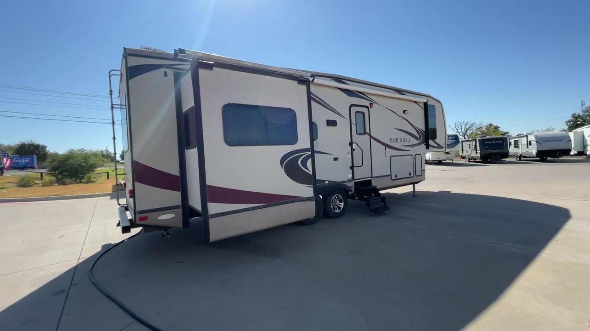 2011 TAN BLUE RIDGE 3125 (4X4FBLG22BG) , Length: 35.17 ft. | Dry Weight: 11,079 lbs. | Gross Weight: 13,975 lbs. | Slides: 3 transmission, located at 4319 N Main St, Cleburne, TX, 76033, (817) 678-5133, 32.385960, -97.391212 - Discover the perfect blend of comfort and functionality with the 2011 Blue Ridge 3125. It is a meticulously designed fifth-wheel trailer crafted for unforgettable travel experiences. Extending to 35 feet, this model incorporates three slide-outs, ingeniously expanding the living space to create an i - Photo#1