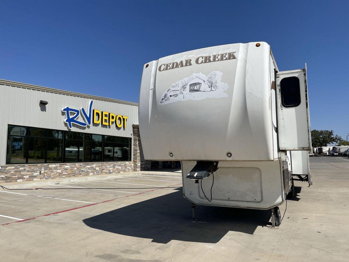 2011 WHITE CEDAR CREEK 36RE - (4X4FCRM24BS) , Length: 39 ft. | Dry Weight: 12,095 lbs. | Gross Weight: 15,500 lbs. | Slides: 3 transmission, located at 4319 N Main St, Cleburne, TX, 76033, (817) 678-5133, 32.385960, -97.391212 - The 2011 Forest River Cedar Creek 36RE is a spacious and meticulously designed fifth-wheel RV, measuring 39 feet in length and 8 feet in width. With a dry weight of 12,095 lbs and a substantial GVWR of 15,500 lbs, this RV strikes a balance between size and towing efficiency. The aluminum superstruct - Photo#0