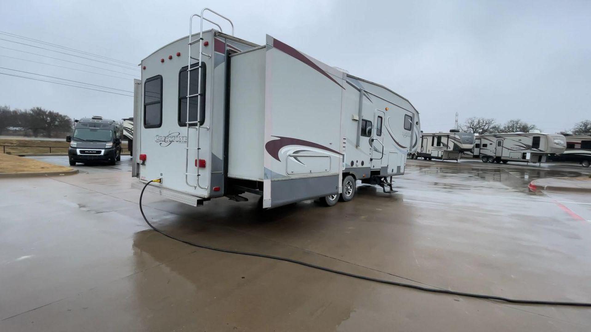 2011 GRAY GREYSTONE 33QB - (5SFSG3624BE) , Length: 36.8 ft. | Dry Weight: 11,466 lbs. | Gross Weight: 13,935 lbs. | Slides: 4 transmission, located at 4319 N Main St, Cleburne, TX, 76033, (817) 678-5133, 32.385960, -97.391212 - Reasons to buy this RV include: (1) With four generous slide-outs, the interior space of this RV expands dramatically, providing ample room for relaxation and entertainment. (2) It features high-gloss fiberglass finish offers a sleek, modern aesthetic while providing a durable and low-maintenance - Photo#1