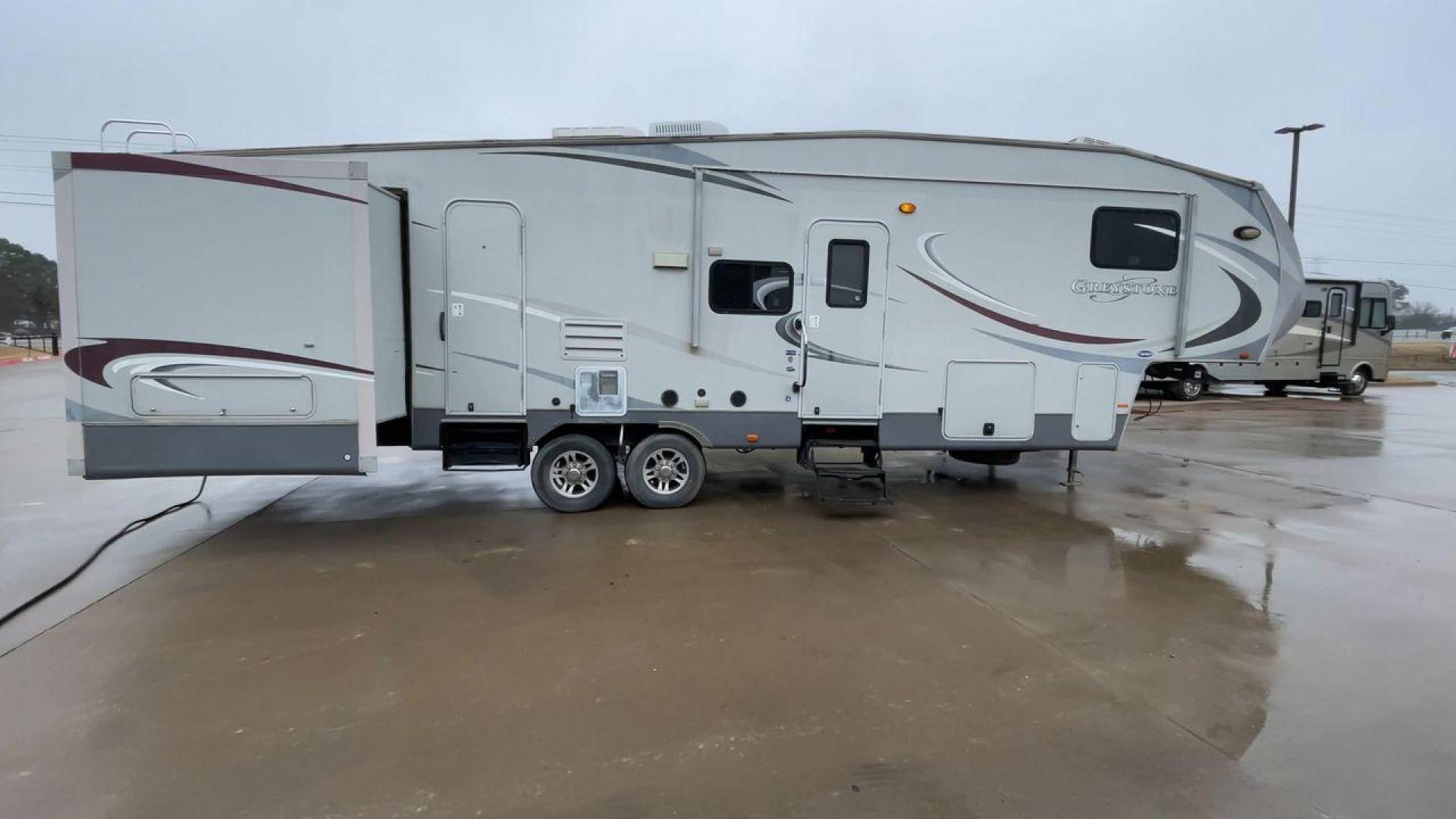 2011 GRAY GREYSTONE 33QB - (5SFSG3624BE) , Length: 36.8 ft. | Dry Weight: 11,466 lbs. | Gross Weight: 13,935 lbs. | Slides: 4 transmission, located at 4319 N Main St, Cleburne, TX, 76033, (817) 678-5133, 32.385960, -97.391212 - Reasons to buy this RV include: (1) With four generous slide-outs, the interior space of this RV expands dramatically, providing ample room for relaxation and entertainment. (2) It features high-gloss fiberglass finish offers a sleek, modern aesthetic while providing a durable and low-maintenance - Photo#2