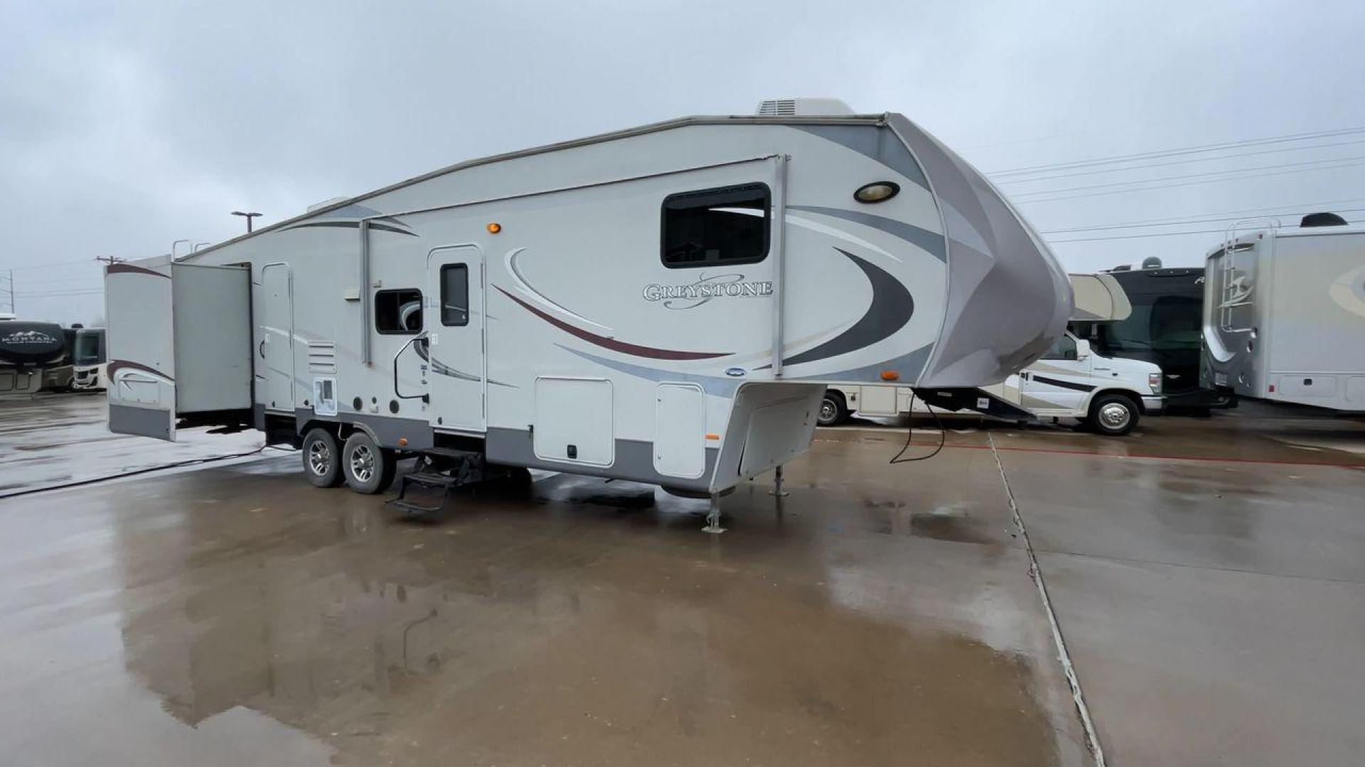 2011 GRAY GREYSTONE 33QB - (5SFSG3624BE) , Length: 36.8 ft. | Dry Weight: 11,466 lbs. | Gross Weight: 13,935 lbs. | Slides: 4 transmission, located at 4319 N Main St, Cleburne, TX, 76033, (817) 678-5133, 32.385960, -97.391212 - Reasons to buy this RV include: (1) With four generous slide-outs, the interior space of this RV expands dramatically, providing ample room for relaxation and entertainment. (2) It features high-gloss fiberglass finish offers a sleek, modern aesthetic while providing a durable and low-maintenance - Photo#3