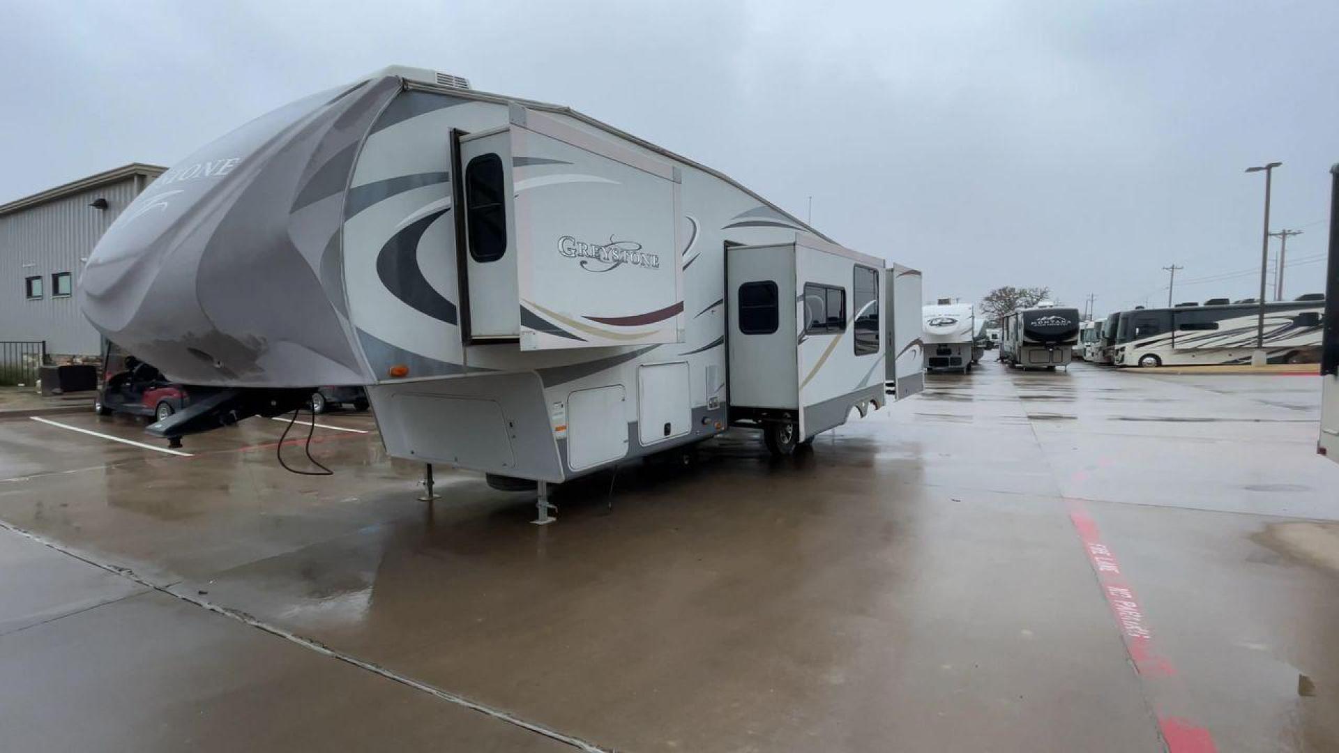 2011 GRAY GREYSTONE 33QB - (5SFSG3624BE) , Length: 36.8 ft. | Dry Weight: 11,466 lbs. | Gross Weight: 13,935 lbs. | Slides: 4 transmission, located at 4319 N Main St, Cleburne, TX, 76033, (817) 678-5133, 32.385960, -97.391212 - Reasons to buy this RV include: (1) With four generous slide-outs, the interior space of this RV expands dramatically, providing ample room for relaxation and entertainment. (2) It features high-gloss fiberglass finish offers a sleek, modern aesthetic while providing a durable and low-maintenance - Photo#5