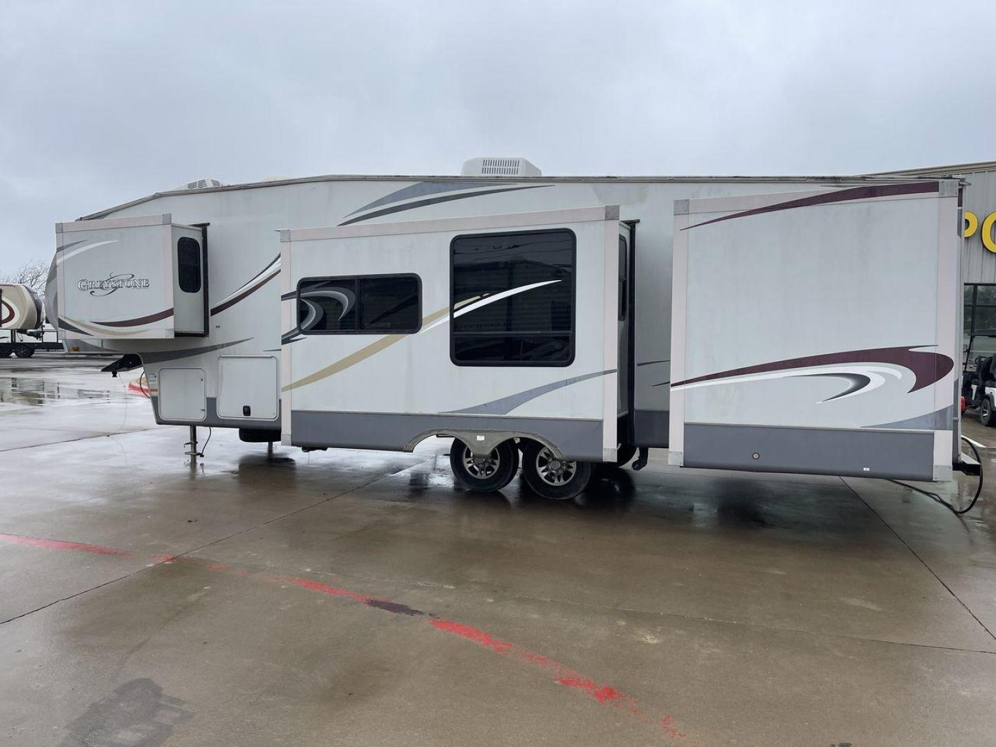 2011 GRAY GREYSTONE 33QB - (5SFSG3624BE) , Length: 36.8 ft. | Dry Weight: 11,466 lbs. | Gross Weight: 13,935 lbs. | Slides: 4 transmission, located at 4319 N Main St, Cleburne, TX, 76033, (817) 678-5133, 32.385960, -97.391212 - Reasons to buy this RV include: (1) With four generous slide-outs, the interior space of this RV expands dramatically, providing ample room for relaxation and entertainment. (2) It features high-gloss fiberglass finish offers a sleek, modern aesthetic while providing a durable and low-maintenance - Photo#24