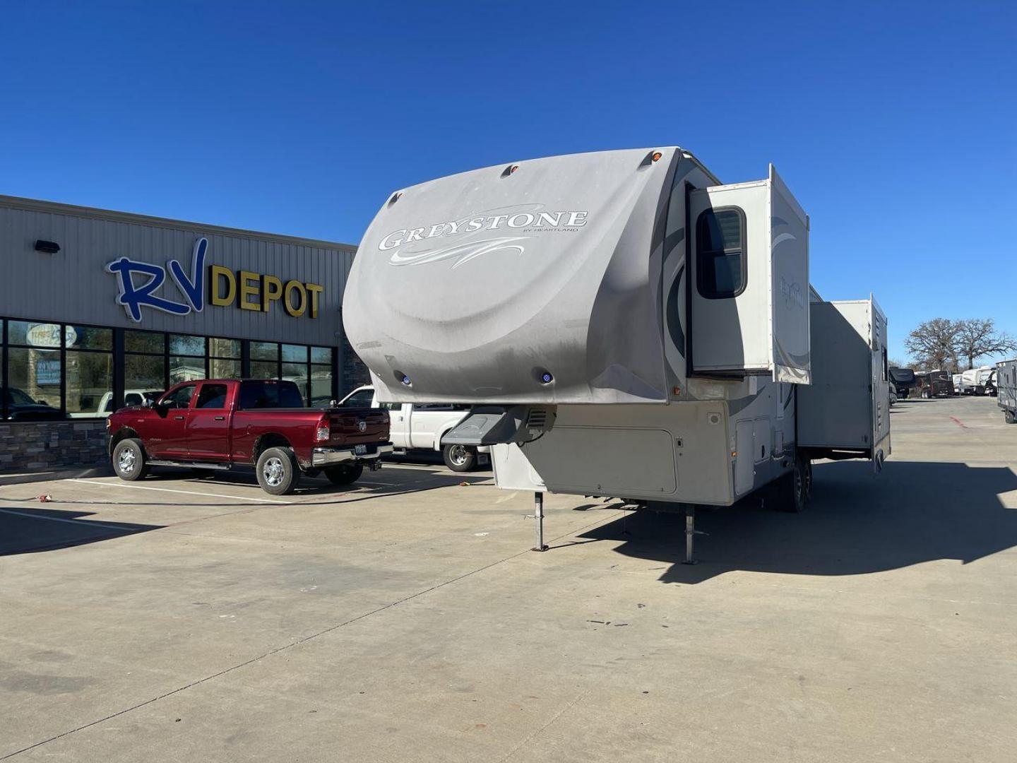 2011 WHITE HEARTLAND GREYSTONE 32RE (5SFSG3228BE) , Length: 34.83 ft. | Dry Weight: 10,421 lbs. | Gross Weight: 13,840 lbs. | Slides: 3 transmission, located at 4319 N Main St, Cleburne, TX, 76033, (817) 678-5133, 32.385960, -97.391212 - This 2011 Heartland Greystone 32RE is a dual-axle aluminum wheel setup measuring nearly 35 feet long. It has a dry weight of 10,421 lbs. and a GVWR of 13,840 lbs. It includes three power slides as well as one 16-foot power awning. This unit features a classic rear living and front bedroom floor plan - Photo#0