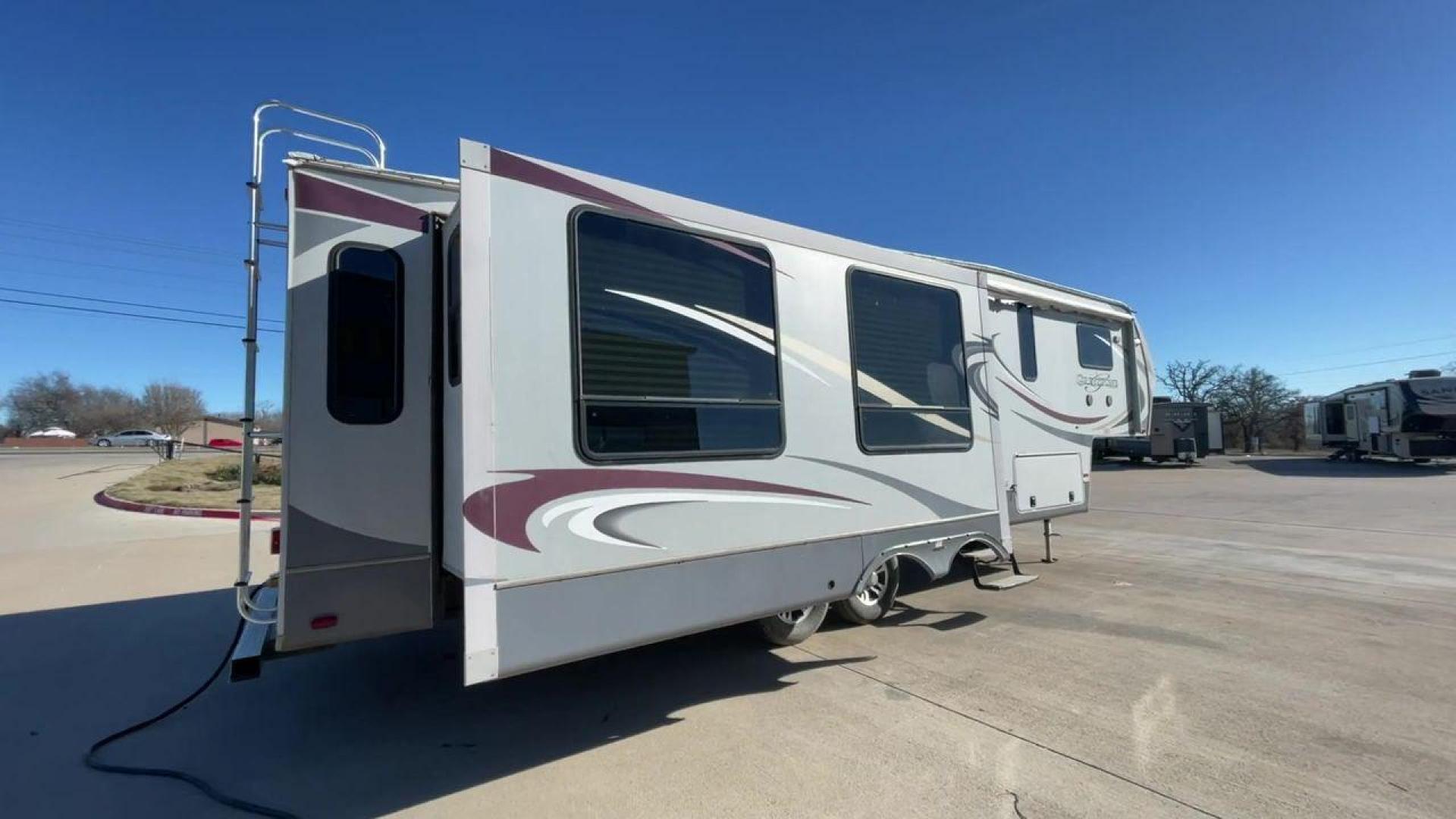 2011 WHITE HEARTLAND GREYSTONE 32RE (5SFSG3228BE) , Length: 34.83 ft. | Dry Weight: 10,421 lbs. | Gross Weight: 13,840 lbs. | Slides: 3 transmission, located at 4319 N Main St, Cleburne, TX, 76033, (817) 678-5133, 32.385960, -97.391212 - This 2011 Heartland Greystone 32RE is a dual-axle aluminum wheel setup measuring nearly 35 feet long. It has a dry weight of 10,421 lbs. and a GVWR of 13,840 lbs. It includes three power slides as well as one 16-foot power awning. This unit features a classic rear living and front bedroom floor plan - Photo#1