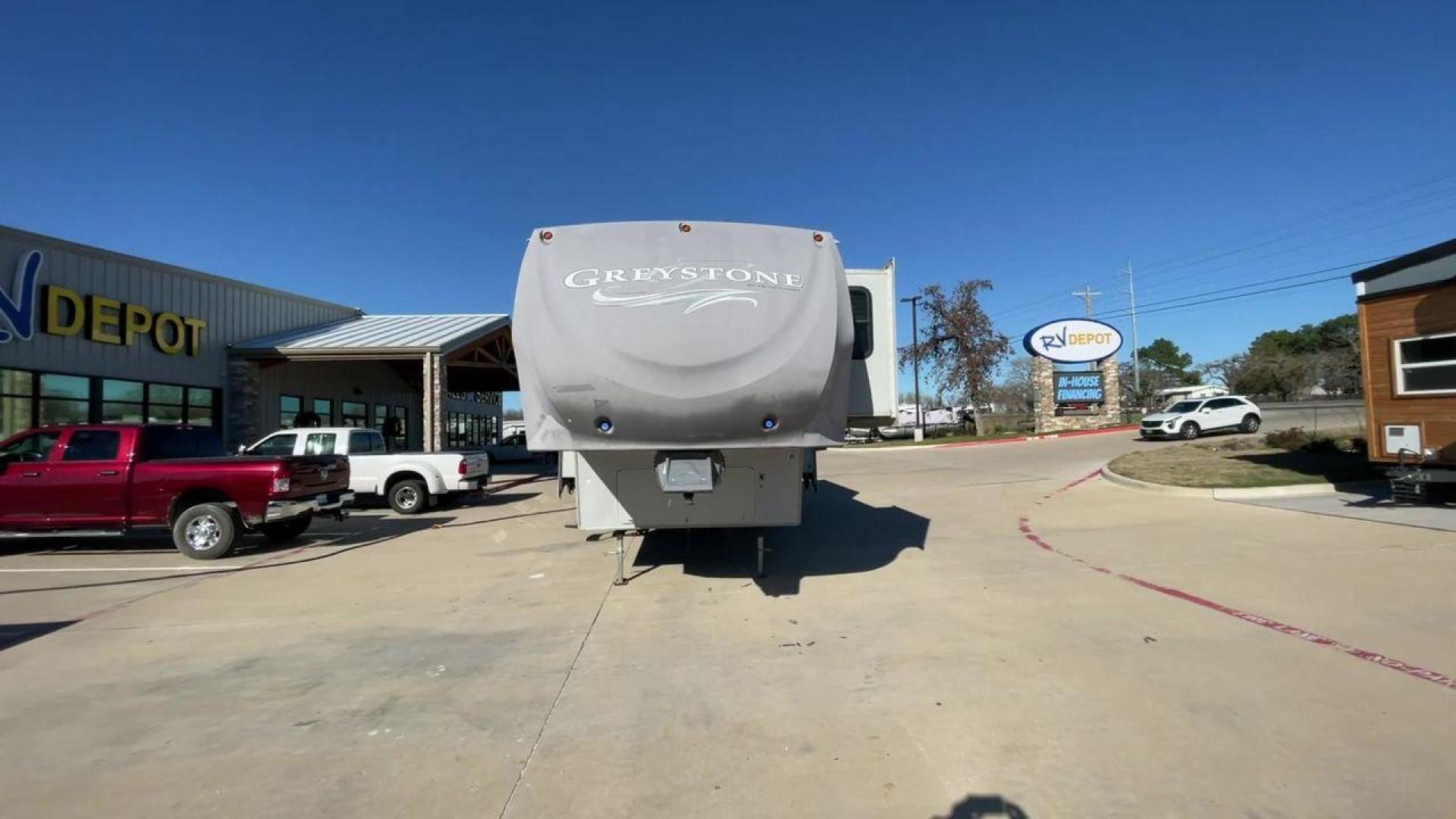 2011 WHITE HEARTLAND GREYSTONE 32RE (5SFSG3228BE) , Length: 34.83 ft. | Dry Weight: 10,421 lbs. | Gross Weight: 13,840 lbs. | Slides: 3 transmission, located at 4319 N Main St, Cleburne, TX, 76033, (817) 678-5133, 32.385960, -97.391212 - This 2011 Heartland Greystone 32RE is a dual-axle aluminum wheel setup measuring nearly 35 feet long. It has a dry weight of 10,421 lbs. and a GVWR of 13,840 lbs. It includes three power slides as well as one 16-foot power awning. This unit features a classic rear living and front bedroom floor plan - Photo#4