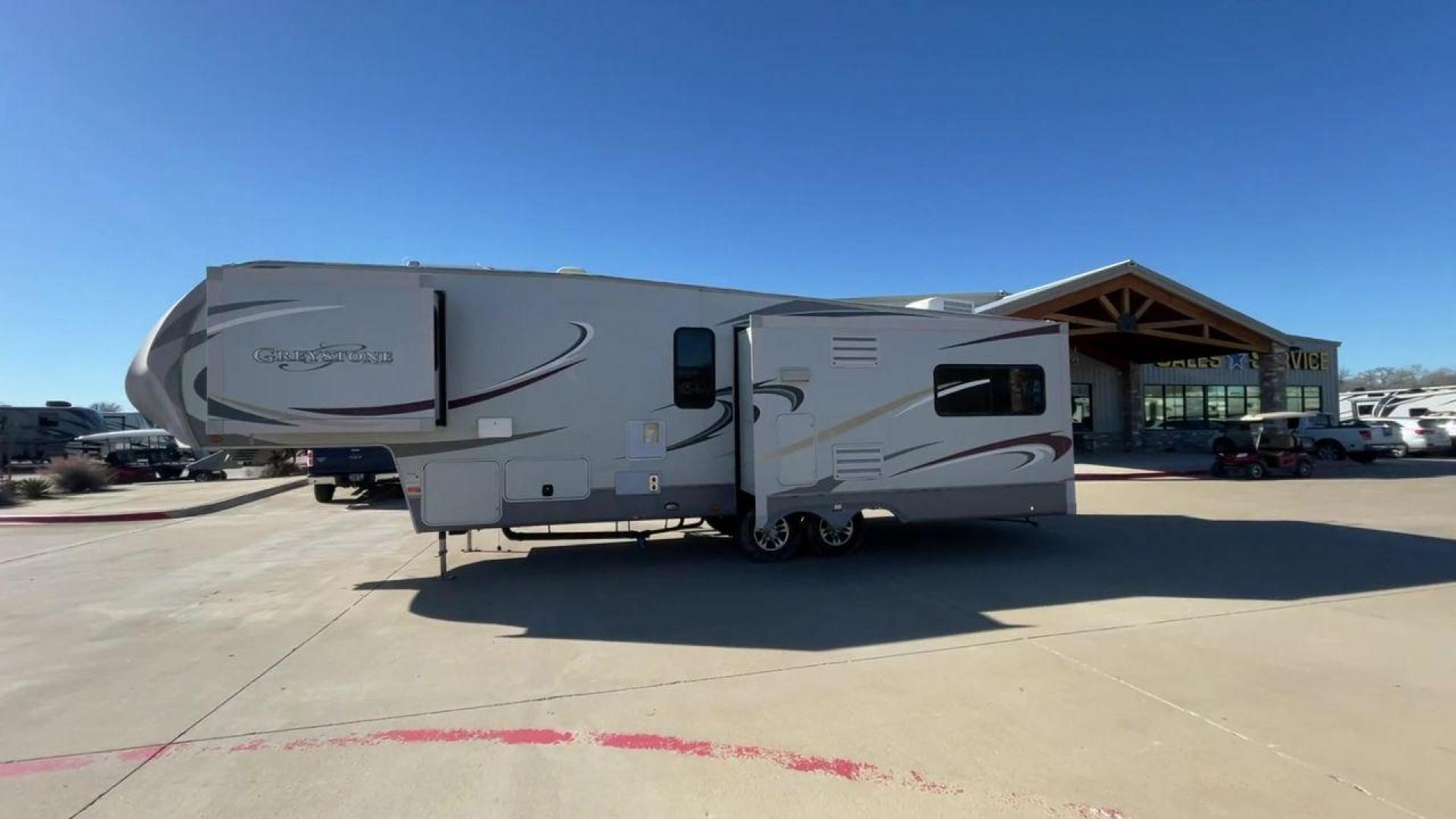 2011 WHITE HEARTLAND GREYSTONE 32RE (5SFSG3228BE) , Length: 34.83 ft. | Dry Weight: 10,421 lbs. | Gross Weight: 13,840 lbs. | Slides: 3 transmission, located at 4319 N Main St, Cleburne, TX, 76033, (817) 678-5133, 32.385960, -97.391212 - This 2011 Heartland Greystone 32RE is a dual-axle aluminum wheel setup measuring nearly 35 feet long. It has a dry weight of 10,421 lbs. and a GVWR of 13,840 lbs. It includes three power slides as well as one 16-foot power awning. This unit features a classic rear living and front bedroom floor plan - Photo#6