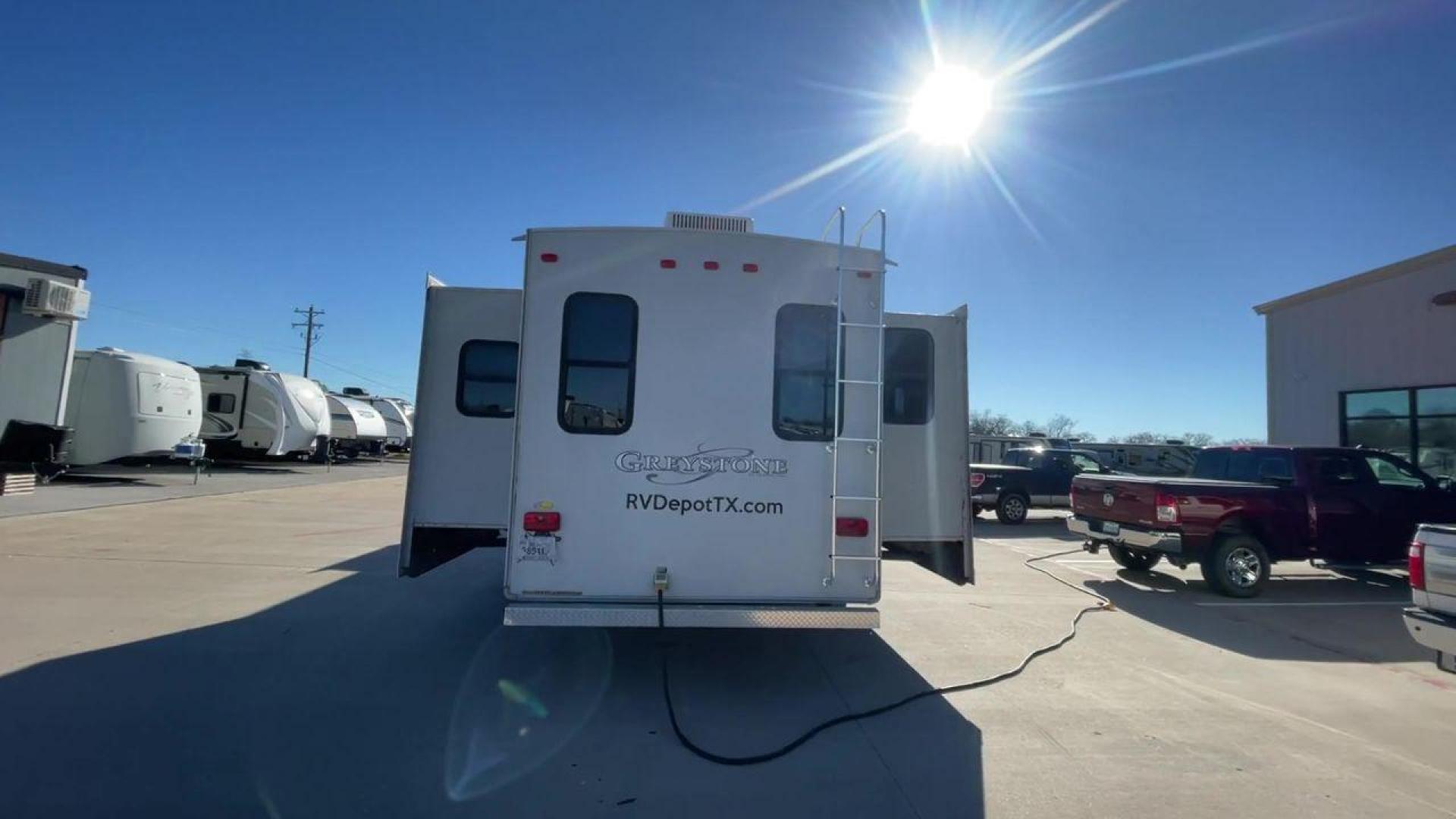 2011 WHITE HEARTLAND GREYSTONE 32RE (5SFSG3228BE) , Length: 34.83 ft. | Dry Weight: 10,421 lbs. | Gross Weight: 13,840 lbs. | Slides: 3 transmission, located at 4319 N Main St, Cleburne, TX, 76033, (817) 678-5133, 32.385960, -97.391212 - This 2011 Heartland Greystone 32RE is a dual-axle aluminum wheel setup measuring nearly 35 feet long. It has a dry weight of 10,421 lbs. and a GVWR of 13,840 lbs. It includes three power slides as well as one 16-foot power awning. This unit features a classic rear living and front bedroom floor plan - Photo#8