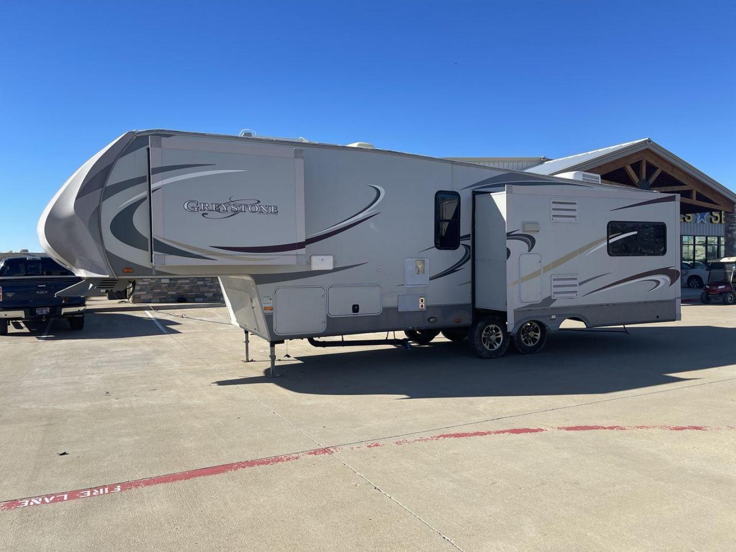 2011 WHITE HEARTLAND GREYSTONE 32RE (5SFSG3228BE) , Length: 34.83 ft. | Dry Weight: 10,421 lbs. | Gross Weight: 13,840 lbs. | Slides: 3 transmission, located at 4319 N Main St, Cleburne, TX, 76033, (817) 678-5133, 32.385960, -97.391212 - This 2011 Heartland Greystone 32RE is a dual-axle aluminum wheel setup measuring nearly 35 feet long. It has a dry weight of 10,421 lbs. and a GVWR of 13,840 lbs. It includes three power slides as well as one 16-foot power awning. This unit features a classic rear living and front bedroom floor plan - Photo#22