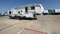 2011 WHITE HEARTLAND ROAD WARRIOR 305RW (5SFCG3021BE) , Length: 35.17 ft. | Dry Weight: 11,186 lbs. | Gross Weight: 14,000 lbs. | Slides: 2 transmission, located at 4319 N Main St, Cleburne, TX, 76033, (817) 678-5133, 32.385960, -97.391212 - With a length of 35.17 ft. and a dry weight of 11,186 lbs, the 2011 Heartland Road Warrior 305RW offers a robust and stylish exterior, designed for both durability and convenience during travel. Its aerodynamic front cap enhances the overall look and performance on the road. The exterior features a - Photo#3