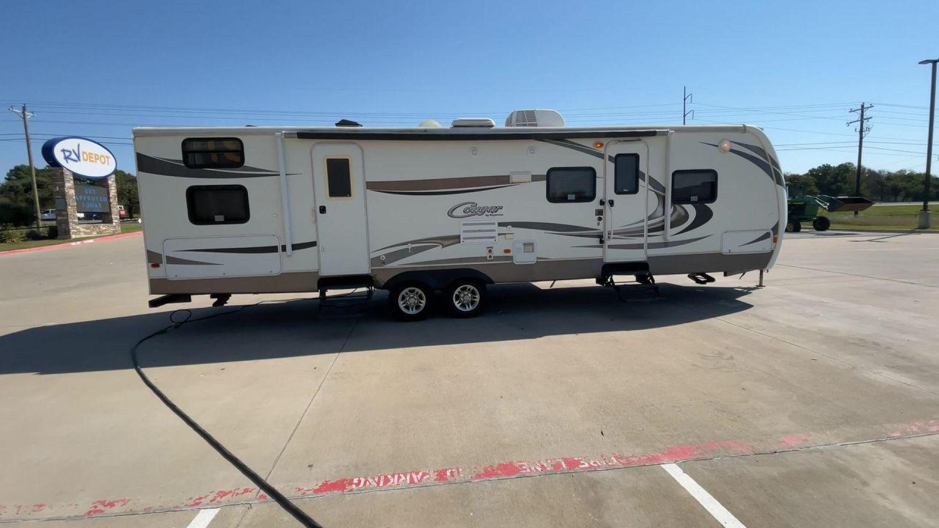 2011 KEYSTONE COUGAR 31SQB (4YDT31S20BV) , Length: 35.42 ft. | Dry Weight: 7,015 lbs. | Gross Weight: 9,000 lbs. | Slides: 2 transmission, located at 4319 N Main St, Cleburne, TX, 76033, (817) 678-5133, 32.385960, -97.391212 - Photo#2