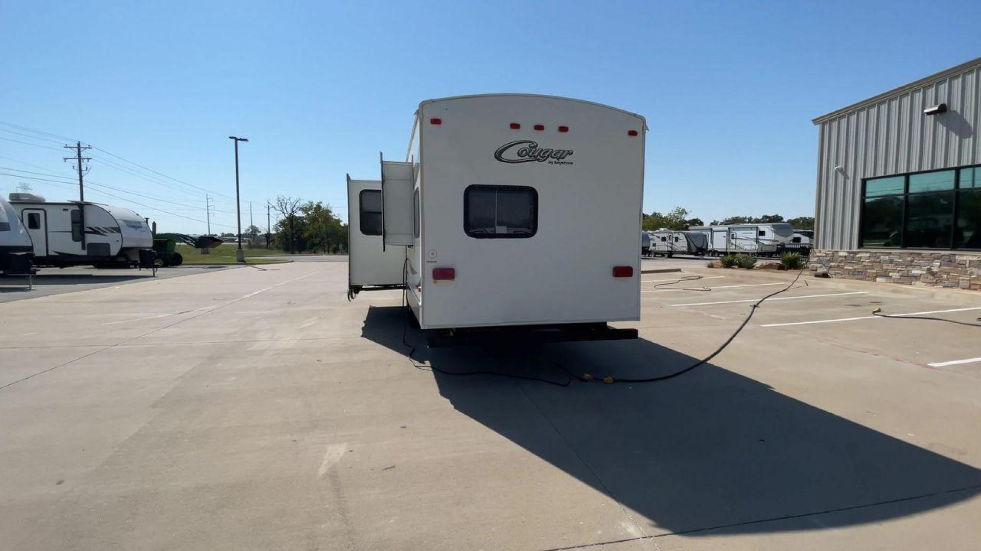 2011 KEYSTONE COUGAR 31SQB (4YDT31S20BV) , Length: 35.42 ft. | Dry Weight: 7,015 lbs. | Gross Weight: 9,000 lbs. | Slides: 2 transmission, located at 4319 N Main St, Cleburne, TX, 76033, (817) 678-5133, 32.385960, -97.391212 - Photo#8