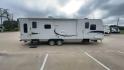 2011 KZ SPREE 323 RL (4EZTP3225B8) , located at 4319 N Main St, Cleburne, TX, 76033, (817) 678-5133, 32.385960, -97.391212 - The 2011 KZSP CT features a clean and functional exterior design with practicality at its core. The white exterior is complemented by simple black graphic accents that stretch along the sides, providing a subtle yet stylish contrast. At the rear, the trailer includes a window for added natural light - Photo#2