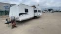 2011 KZ SPREE 323 RL (4EZTP3225B8) , located at 4319 N Main St, Cleburne, TX, 76033, (817) 678-5133, 32.385960, -97.391212 - The 2011 KZSP CT features a clean and functional exterior design with practicality at its core. The white exterior is complemented by simple black graphic accents that stretch along the sides, providing a subtle yet stylish contrast. At the rear, the trailer includes a window for added natural light - Photo#5