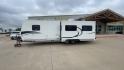 2011 KZ SPREE 323 RL (4EZTP3225B8) , located at 4319 N Main St, Cleburne, TX, 76033, (817) 678-5133, 32.385960, -97.391212 - The 2011 KZSP CT features a clean and functional exterior design with practicality at its core. The white exterior is complemented by simple black graphic accents that stretch along the sides, providing a subtle yet stylish contrast. At the rear, the trailer includes a window for added natural light - Photo#6