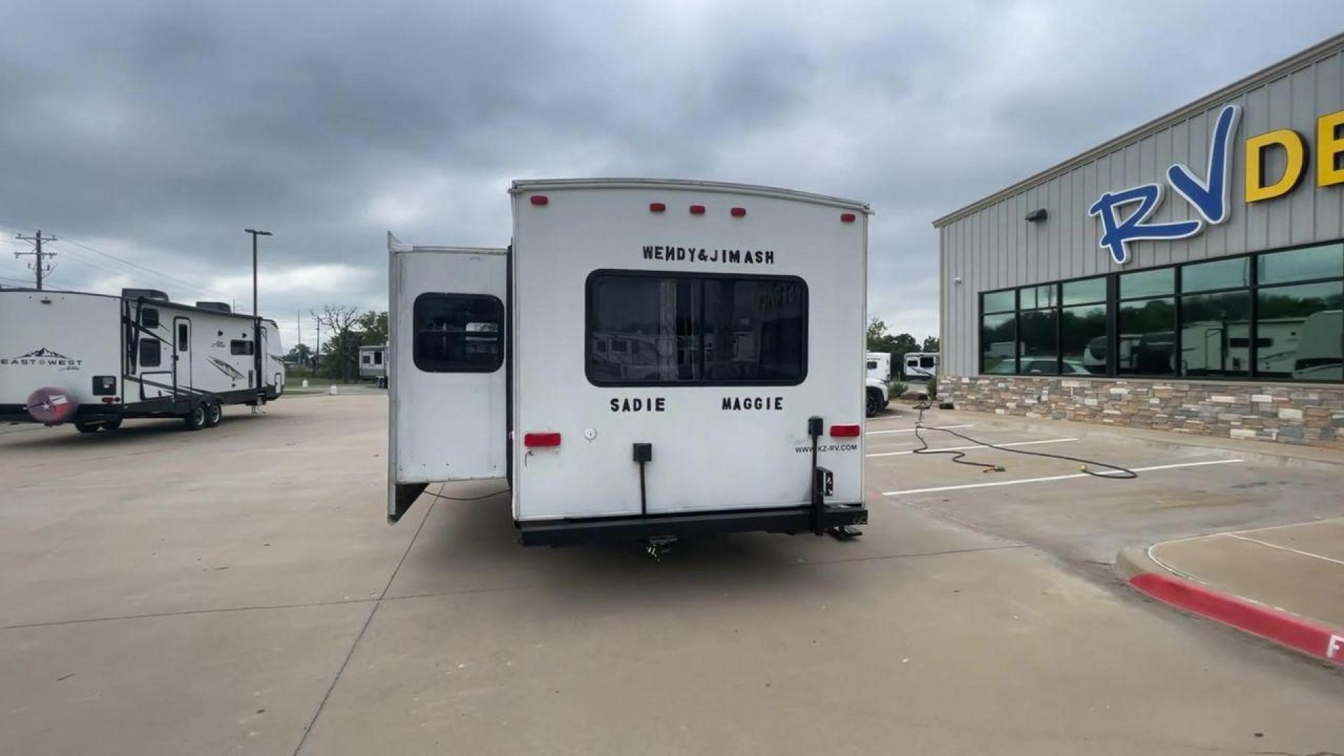 2011 KZ SPREE 323 RL (4EZTP3225B8) , located at 4319 N Main St, Cleburne, TX, 76033, (817) 678-5133, 32.385960, -97.391212 - The 2011 KZSP CT features a clean and functional exterior design with practicality at its core. The white exterior is complemented by simple black graphic accents that stretch along the sides, providing a subtle yet stylish contrast. At the rear, the trailer includes a window for added natural light - Photo#8